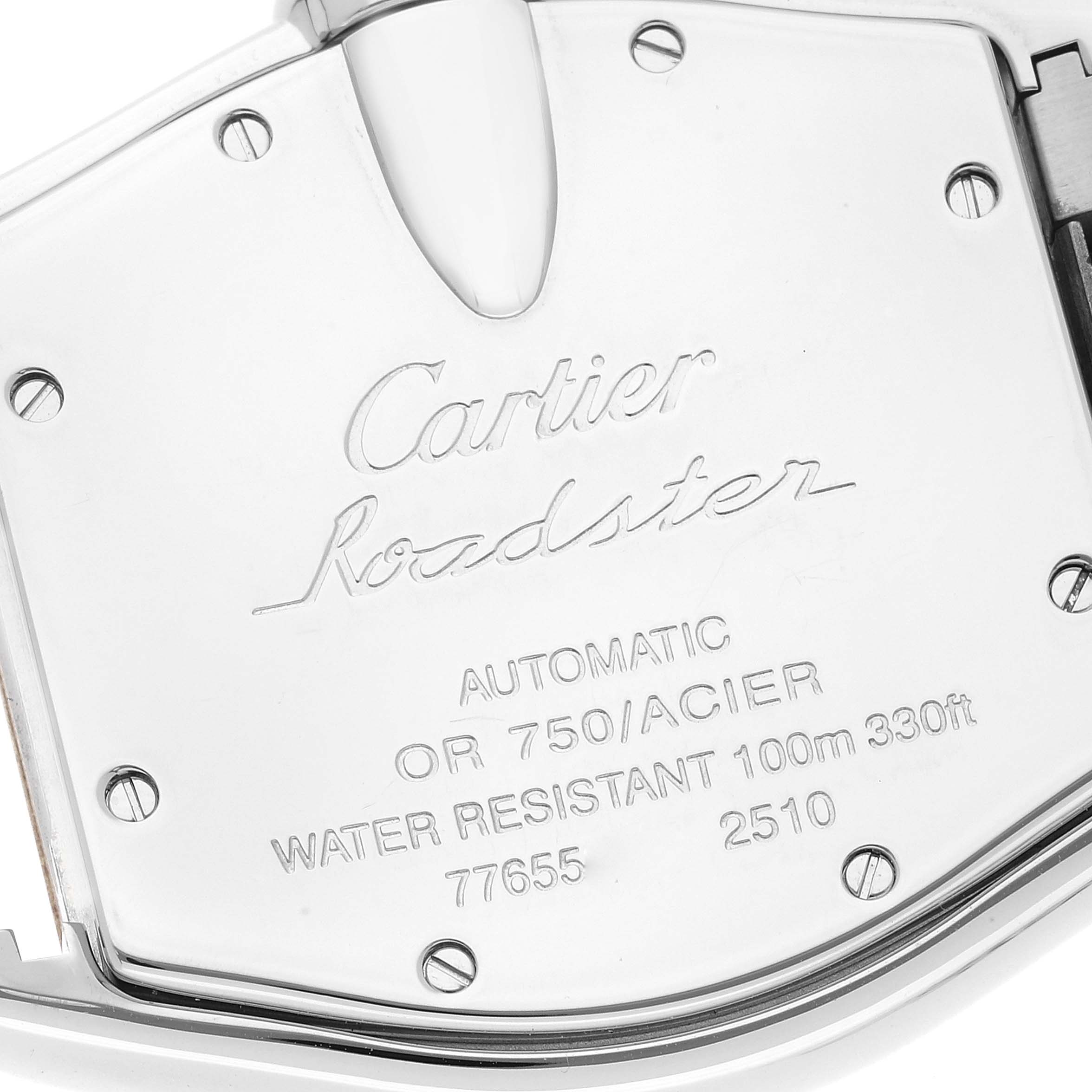 This image shows the back case of a Cartier Roadster W62031Y4 Men's Steel and Gold (two tone) Silver Dial W62031Y4 Men's Steel and Gold (two tone) Silver Dial watch, featuring engraved details and screws.