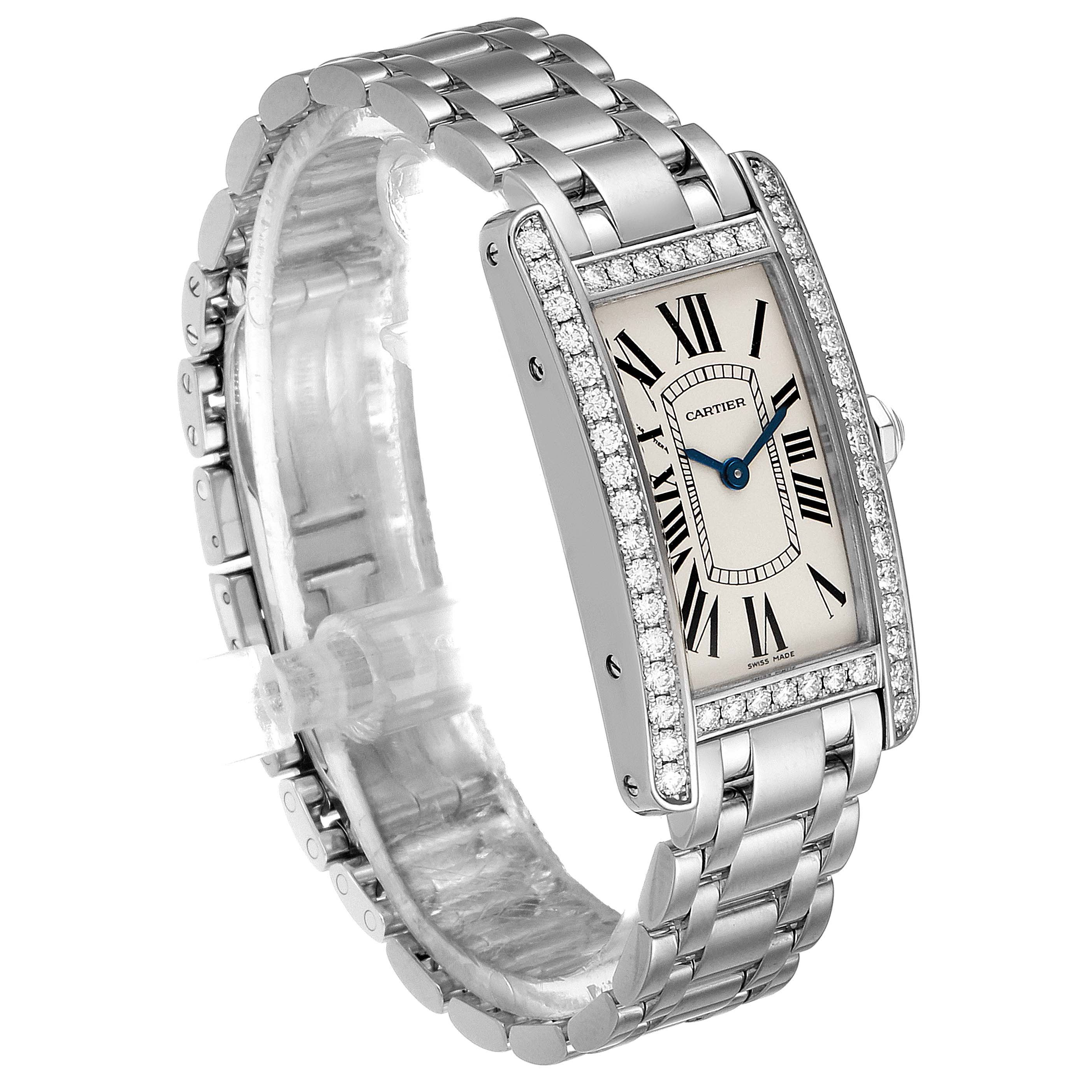 The image shows a Cartier Tank Americaine WB7073L1 Women's White Gold Silver Dial WB7073L1 Women's White Gold Silver Dial watch from a side angle, highlighting its bracelet, rectangular face, and diamond bezel.