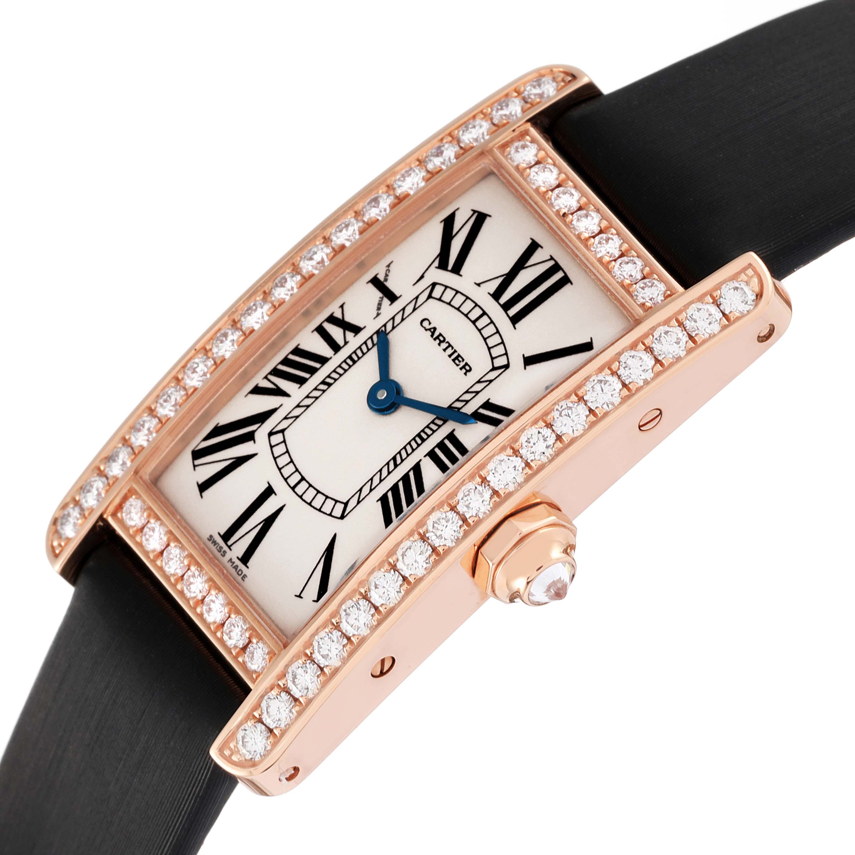The image shows a close-up angle of the Cartier Tank Americaine WJTA0002 Women's Rose Gold Silver Dial WJTA0002 Women's Rose Gold Silver Dial watch, highlighting its diamond-studded bezel and Roman numeral dial.