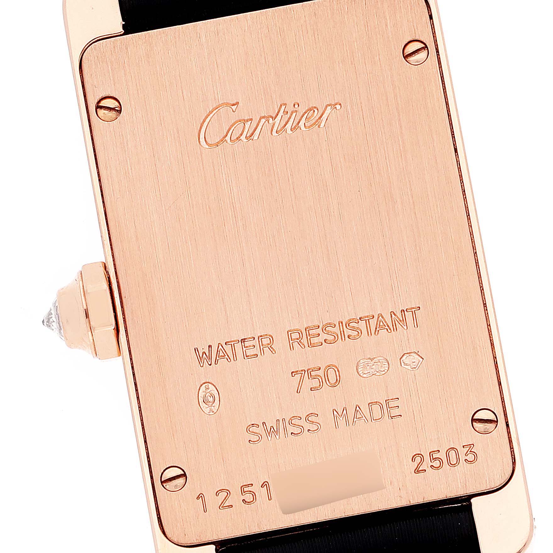 This image shows the back of the Cartier Tank Americaine WJTA0002 Women's Rose Gold Silver Dial WJTA0002 Women's Rose Gold Silver Dial watch, displaying details like water resistance, material, and serial numbers.