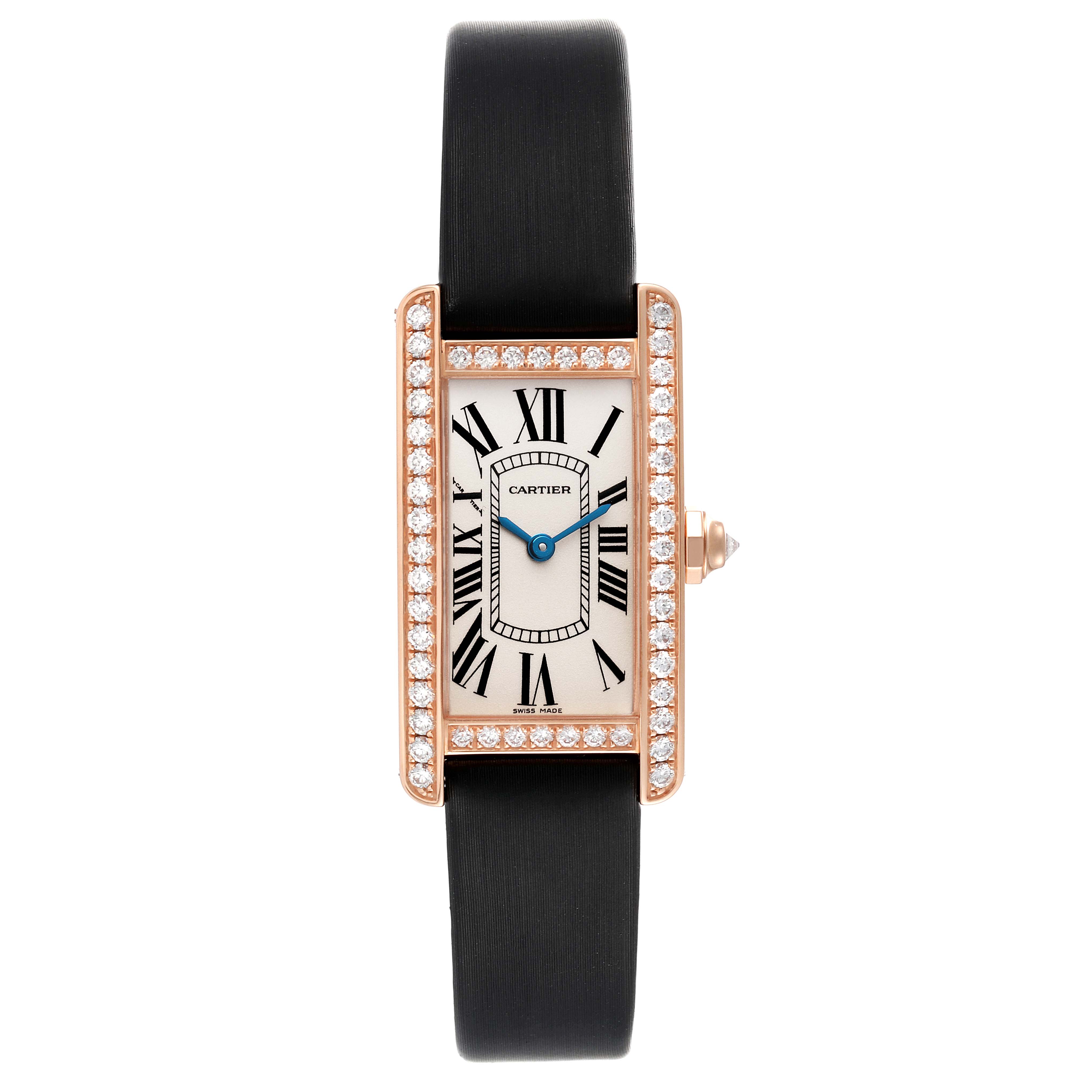 The image shows a front view of the Cartier Tank Americaine WJTA0002 Women's Rose Gold Silver Dial WJTA0002 Women's Rose Gold Silver Dial watch, displaying its face, diamond-studded bezel, and black strap.