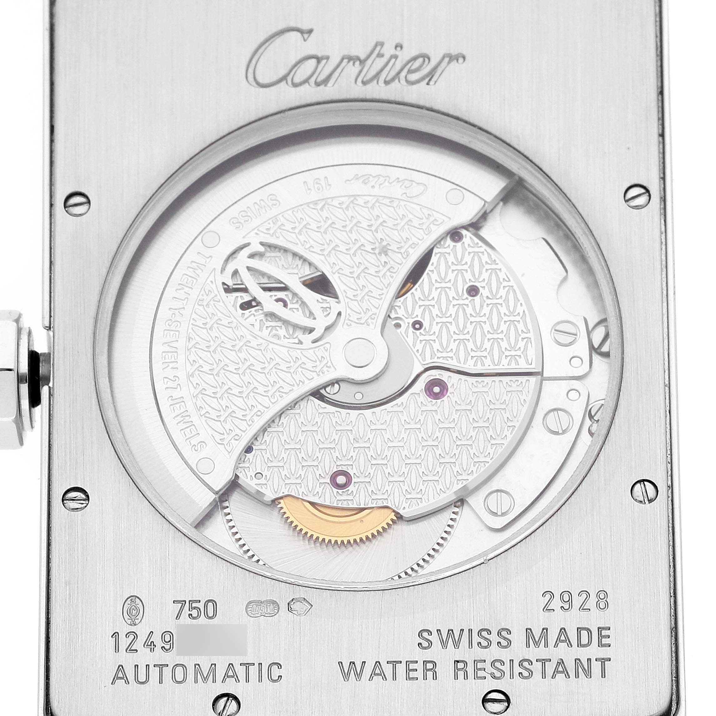 The image shows the intricate movement and mechanism of the Cartier Tank Americaine W2609956 Men's White Gold Silver Dial W2609956 Men's White Gold Silver Dial model from a close-up rear angle.