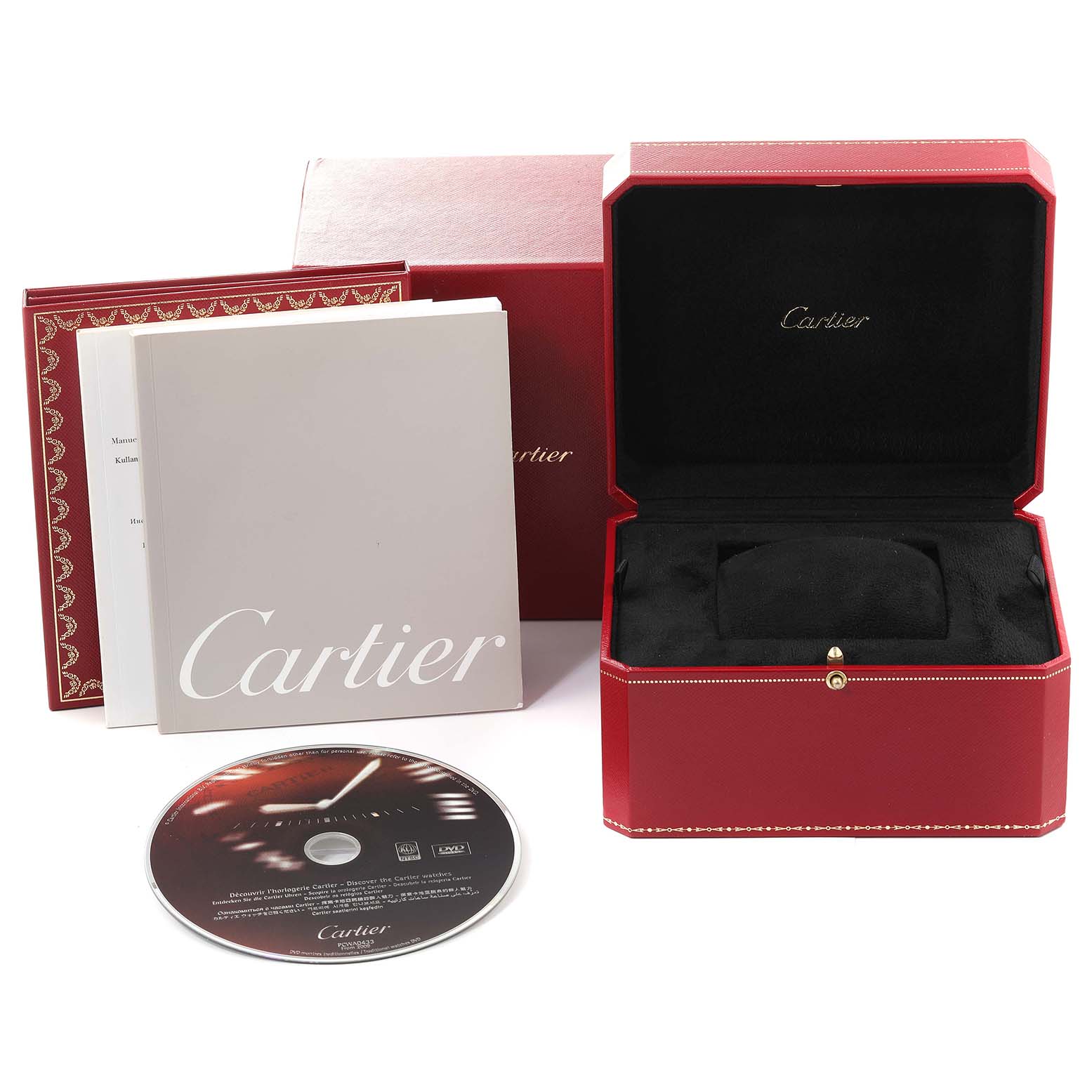 The image shows the packaging and accessories for a Cartier Tank Americaine W2609956 Men's White Gold Silver Dial W2609956 Men's White Gold Silver Dial watch, including a presentation box, booklet, and CD.