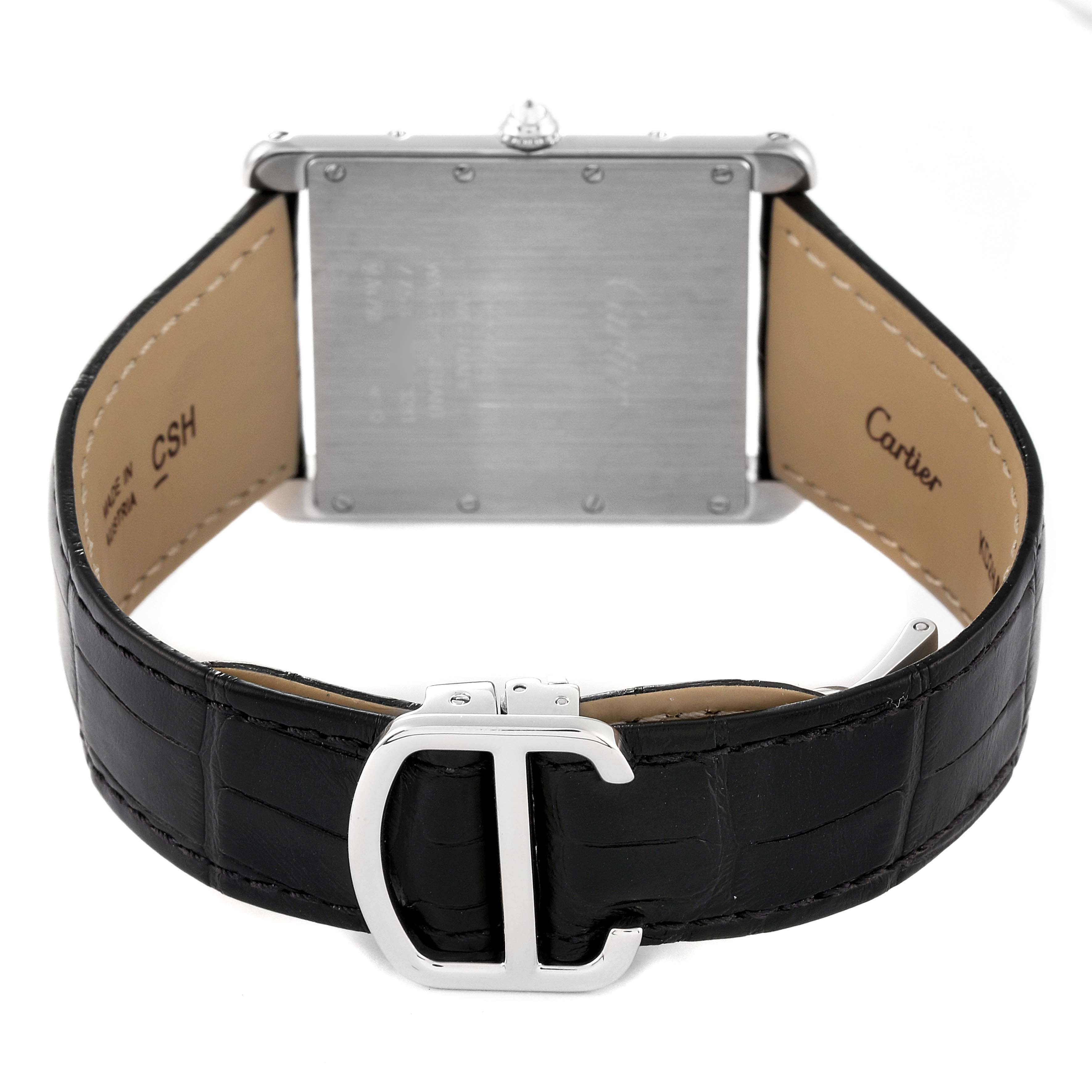 This image shows the backside of a Cartier Tank Louis WT200006 Men's White Gold Silver Dial WT200006 Men's White Gold Silver Dial watch, including the case back and leather strap with the buckle clasp.