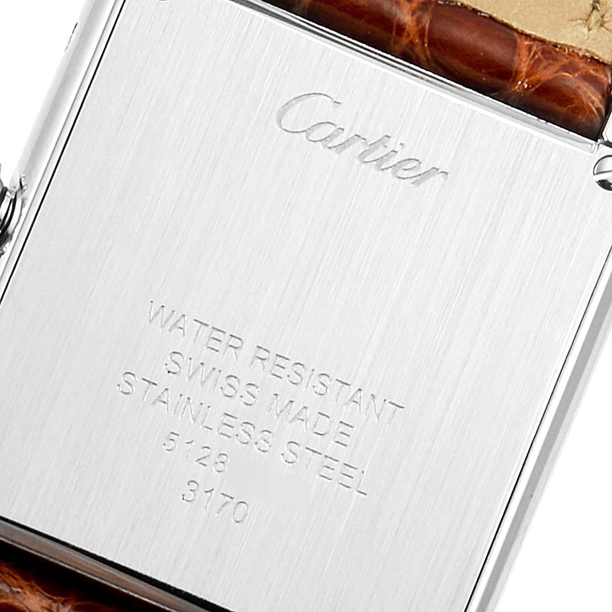 The image shows the back casing of a Cartier Tank Solo W1018255 Women's Stainless Steel Silver Dial W1018255 Women's Stainless Steel Silver Dial watch, displaying the brand engraving and material details.