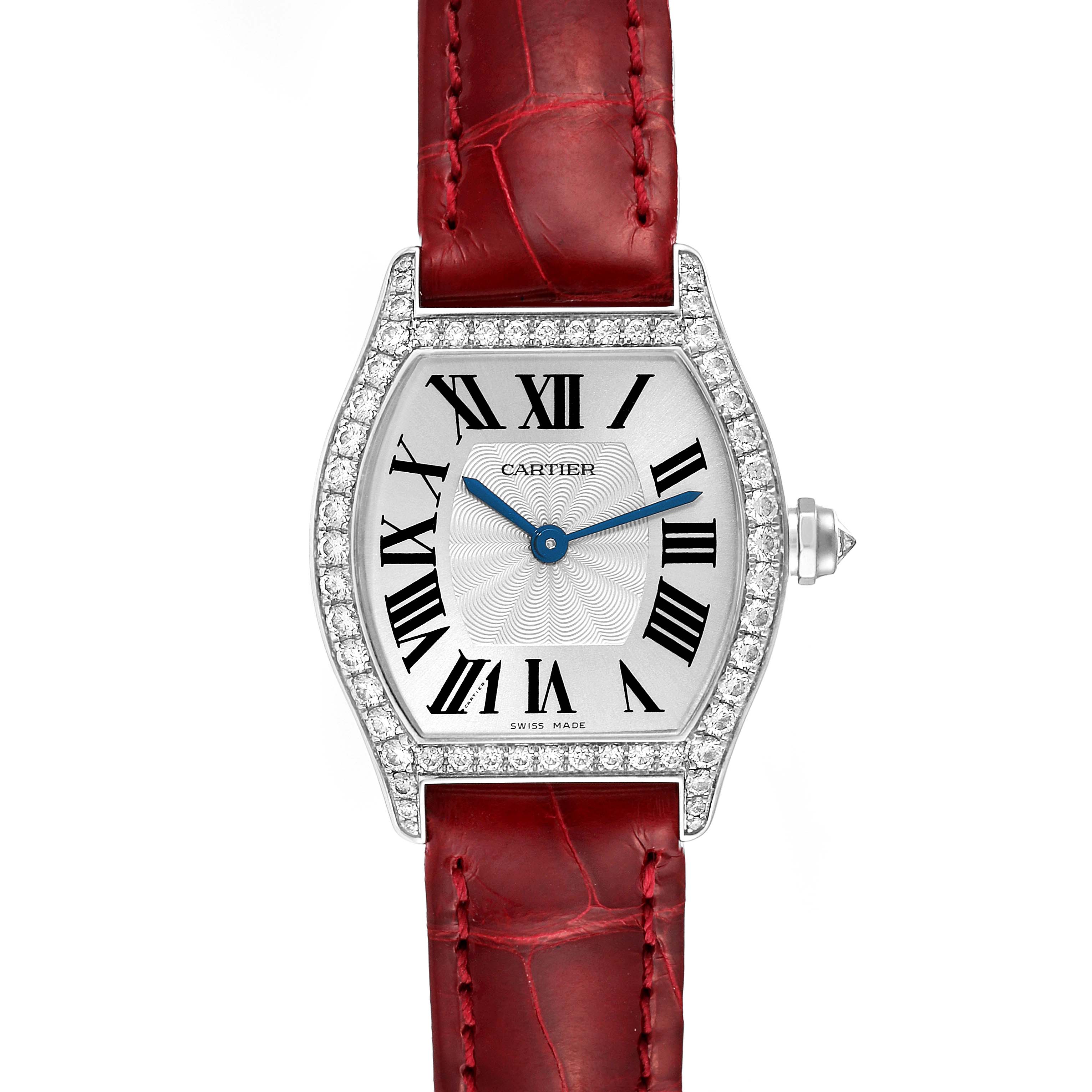 The image shows a frontal view of the Cartier Tortue WA501007 Women's White Gold Silver Dial WA501007 Women's White Gold Silver Dial watch, featuring its red strap, diamond bezel, and Roman numeral dial.