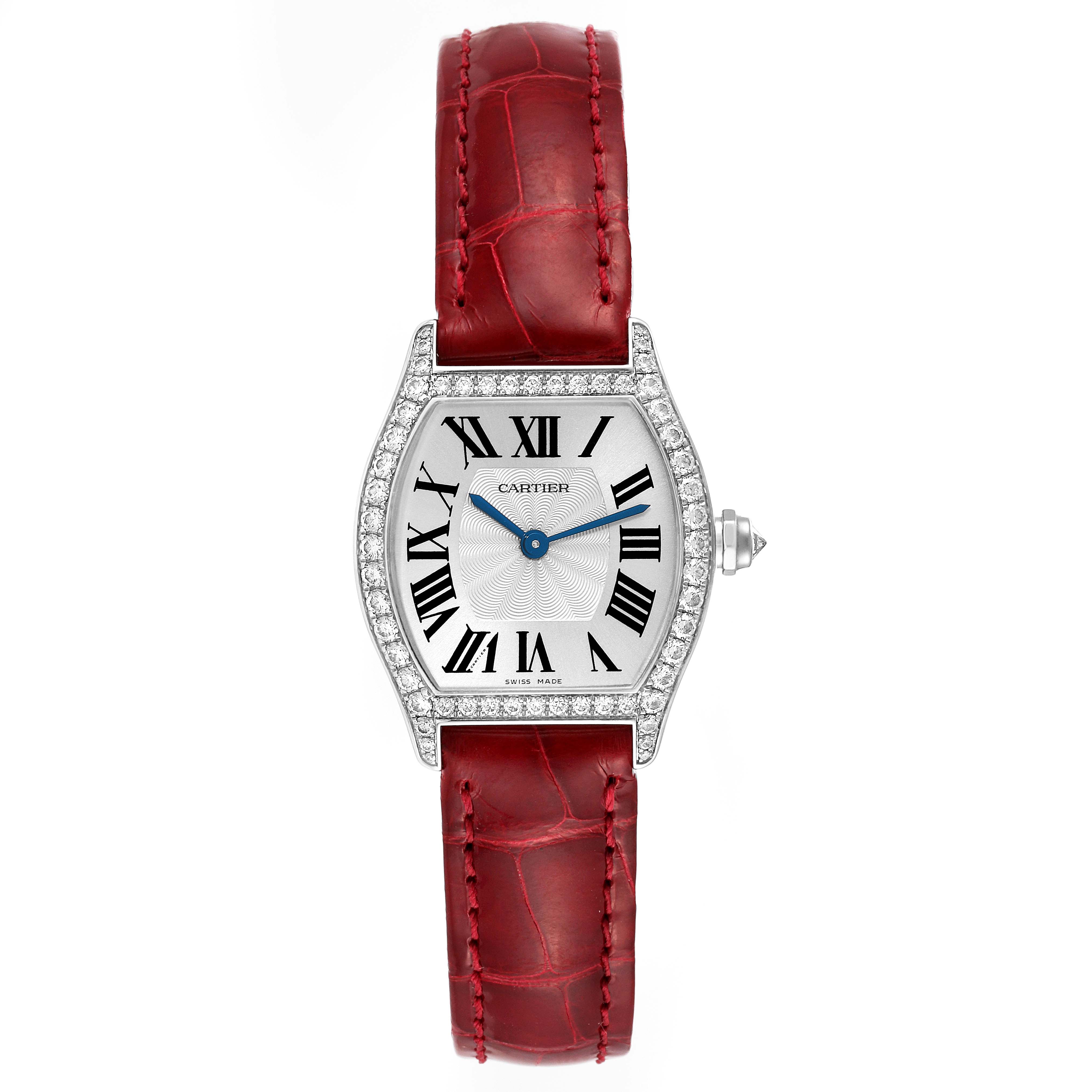 The image shows a Cartier Tortue WA501007 Women's White Gold Silver Dial WA501007 Women's White Gold Silver Dial watch from a top-down angle, featuring a red leather strap and diamond-encrusted case.