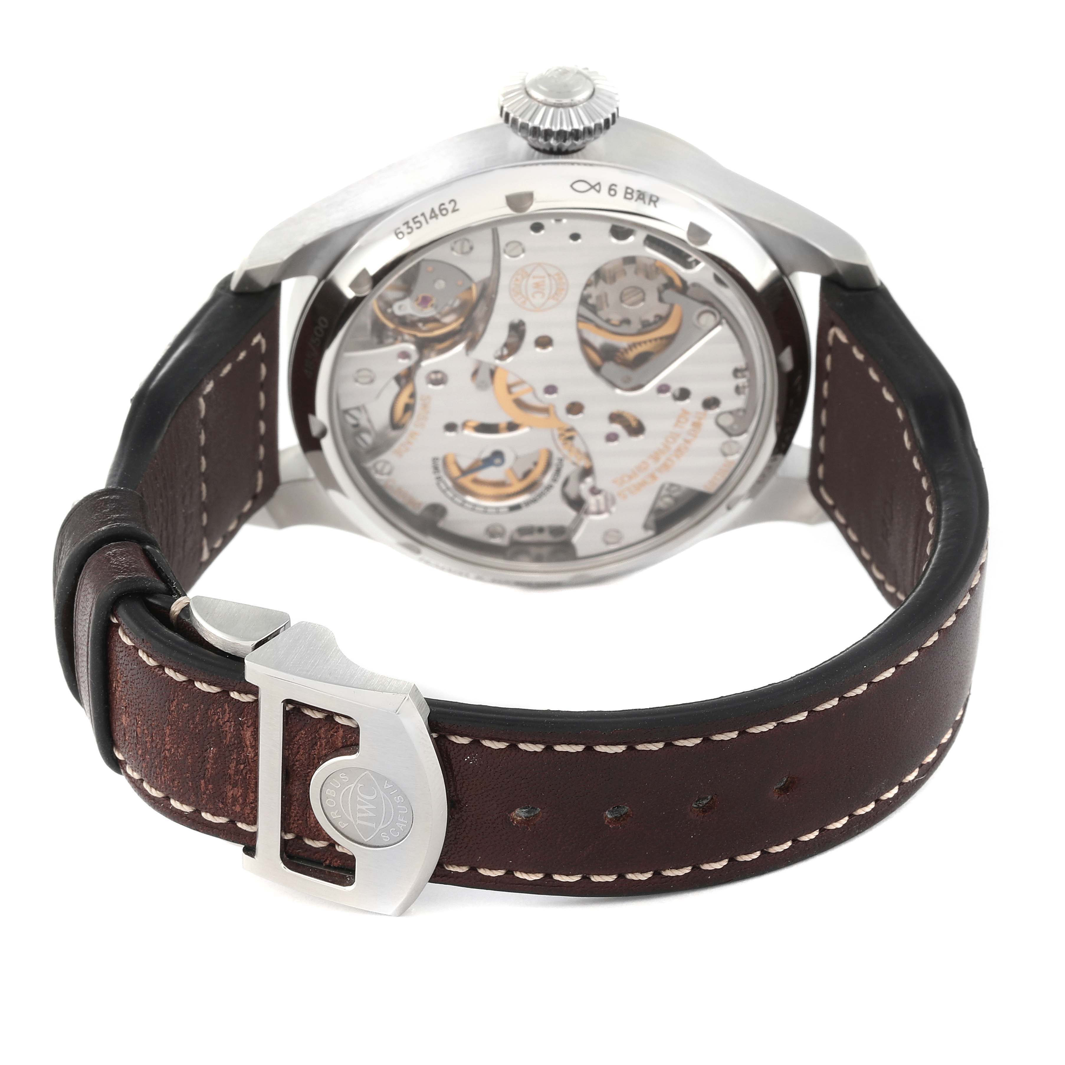 The image shows the back view of an IWC Pilot IW515202 Men's Stainless Steel Blue Dial IW515202 Men's Stainless Steel Blue Dial model watch, highlighting the visible internal mechanism and brown leather strap with a clasp.