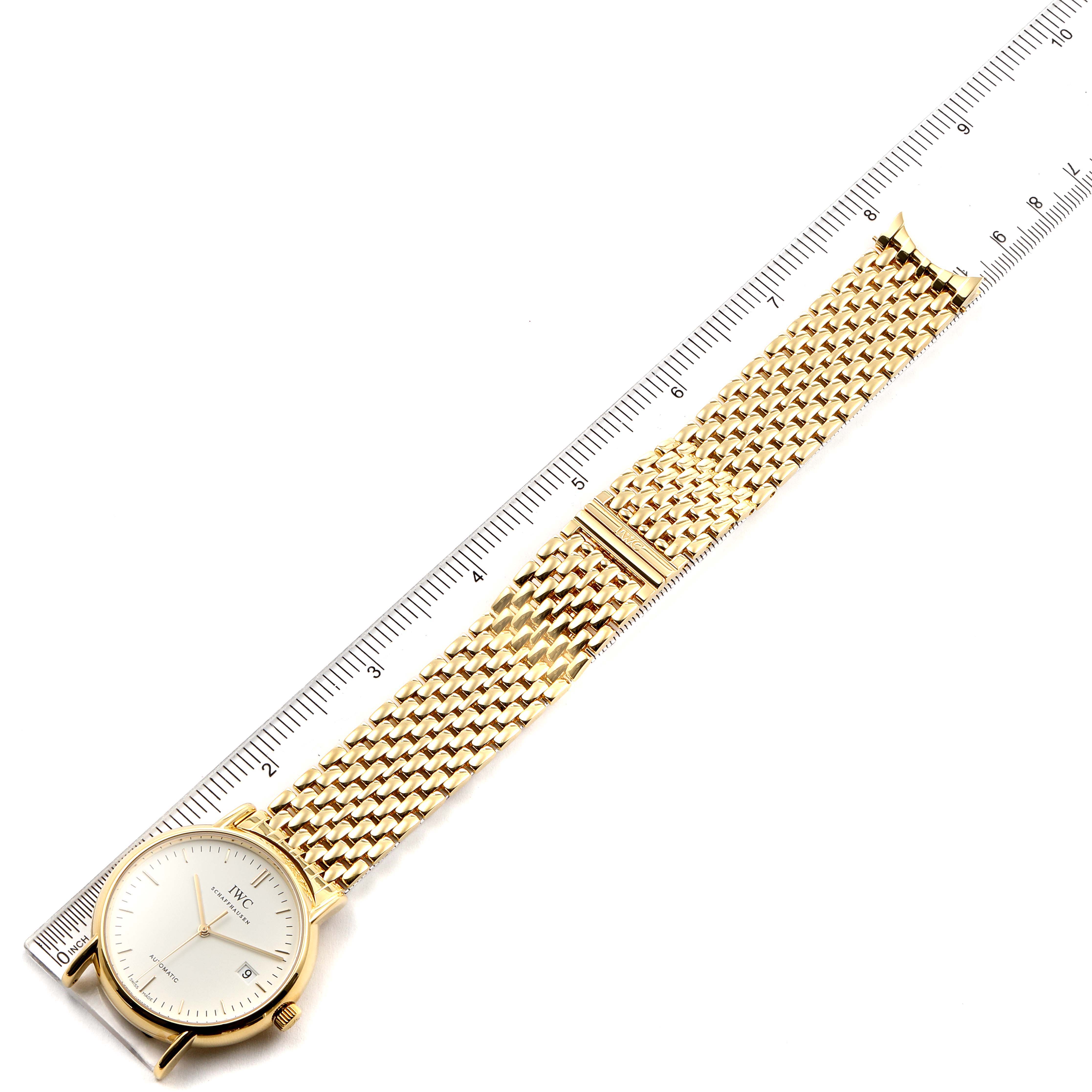 The image shows a gold IWC Portofino IW925101 Men's White Gold White Dial IW925101 Men's White Gold White Dial wristwatch with a mesh band, positioned alongside a ruler for size reference.