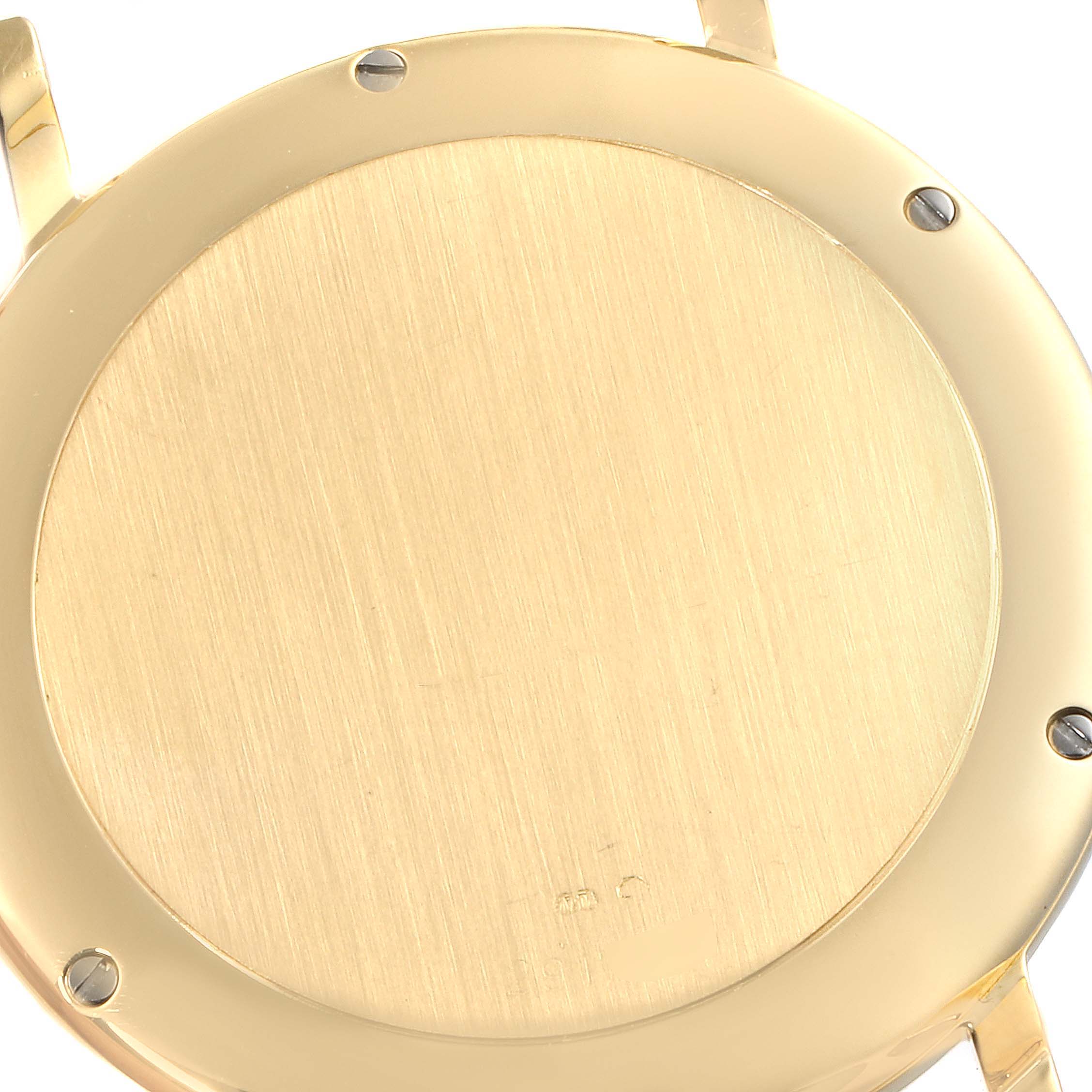 This image shows the back case of the IWC Portofino IW925101 Men's White Gold White Dial IW925101 Men's White Gold White Dial watch from a top-down angle.