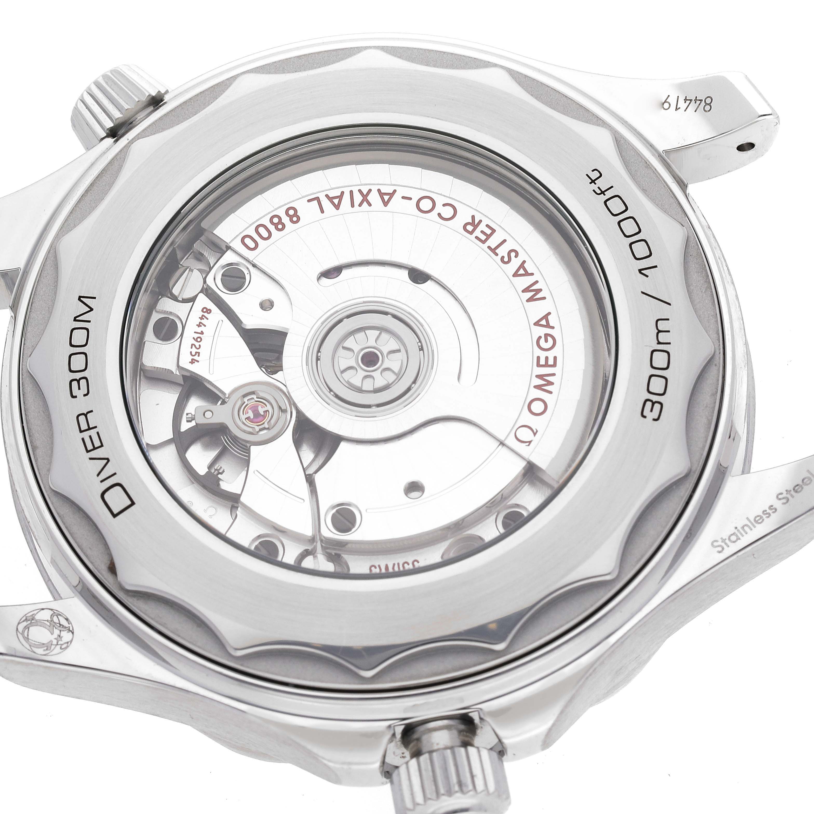 The image shows the back view of an Omega Seamaster 210.32.42.20.10.001 Men's Stainless Steel Green Dial 210.32.42.20.10.001 Men's Stainless Steel Green Dial Diver 300M, highlighting the inner mechanisms and markings.