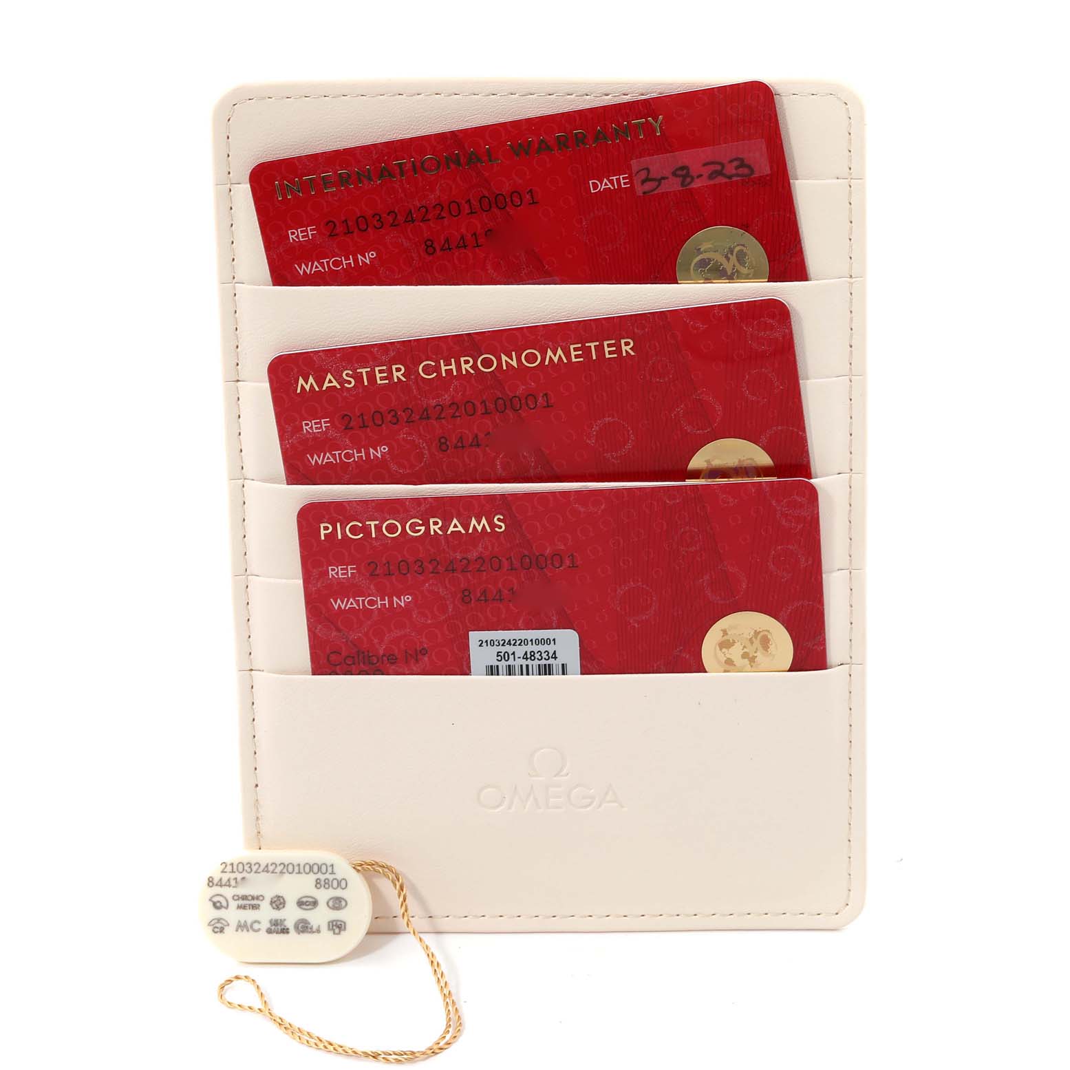 The image shows warranty cards and a tag for the Omega Seamaster 210.32.42.20.10.001 Men's Stainless Steel Green Dial 210.32.42.20.10.001 Men's Stainless Steel Green Dial watch.