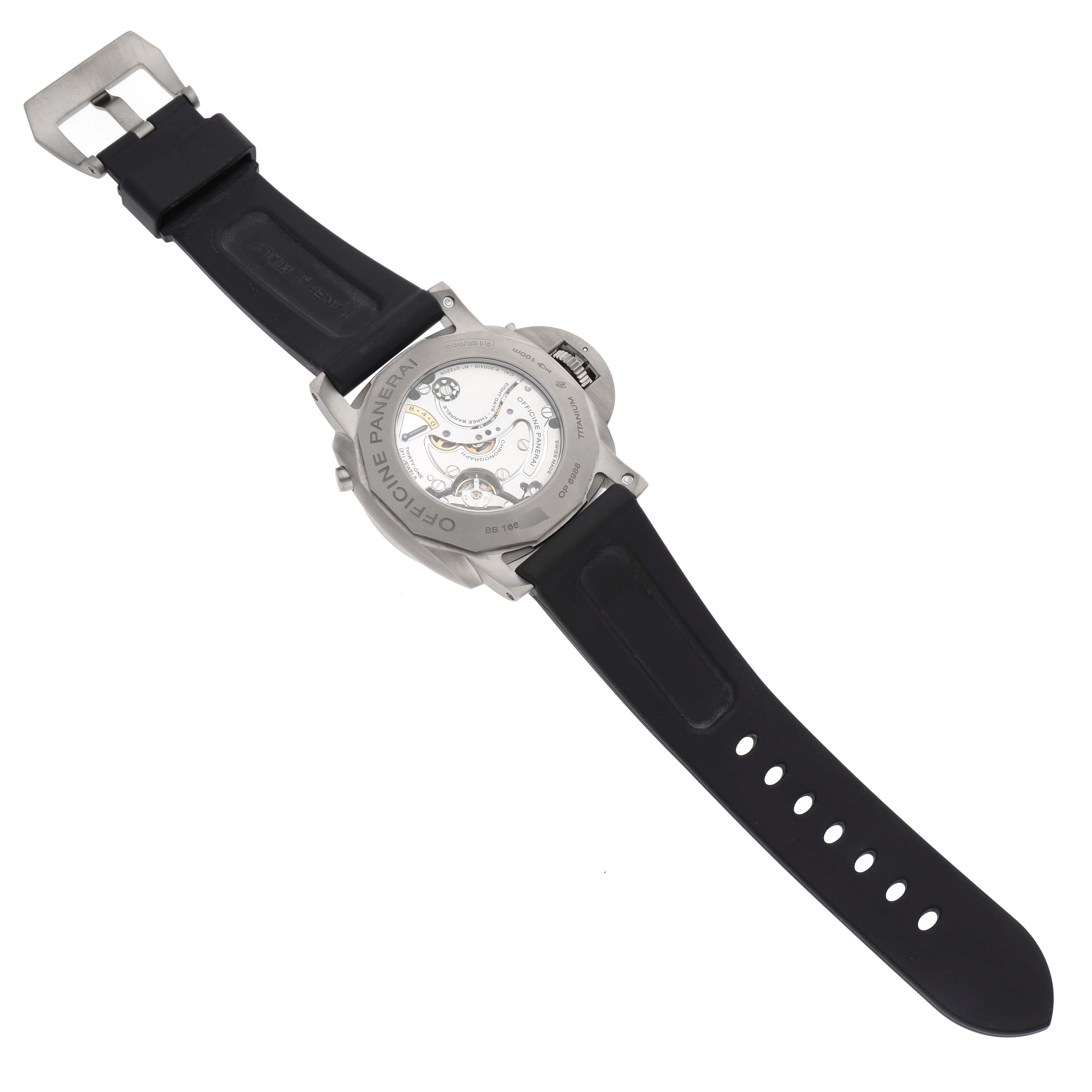 The image shows the back view of a Panerai Luminor PAM00579 Men's Titanium Brown Dial PAM00579 Men's Titanium Brown Dial watch, highlighting the movement and black rubber strap.