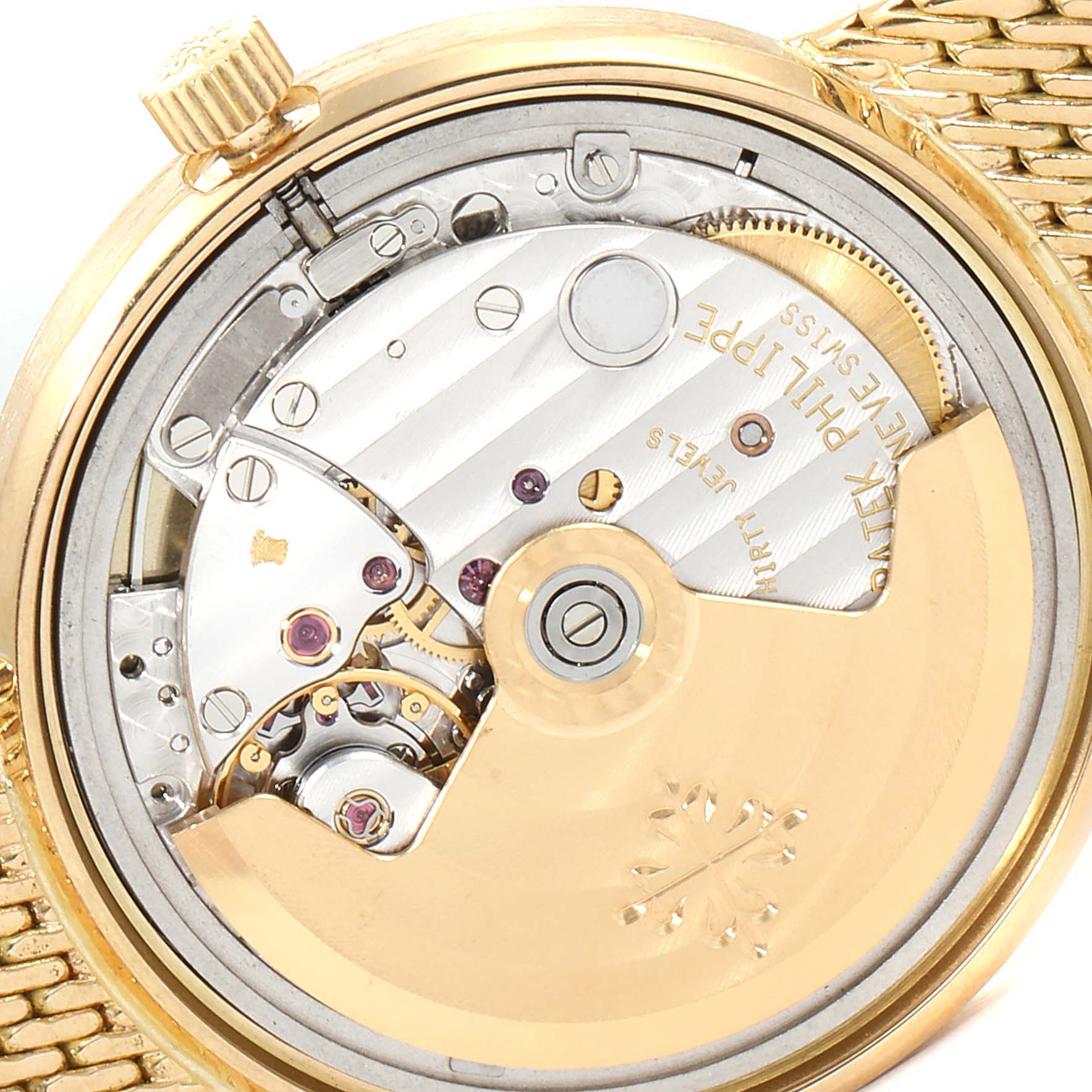 The image shows the exposed mechanical movement of a Patek Philippe Calatrava 3802 Men's Yellow Gold Beige Dial 3802 Men's Yellow Gold Beige Dial watch from the back.