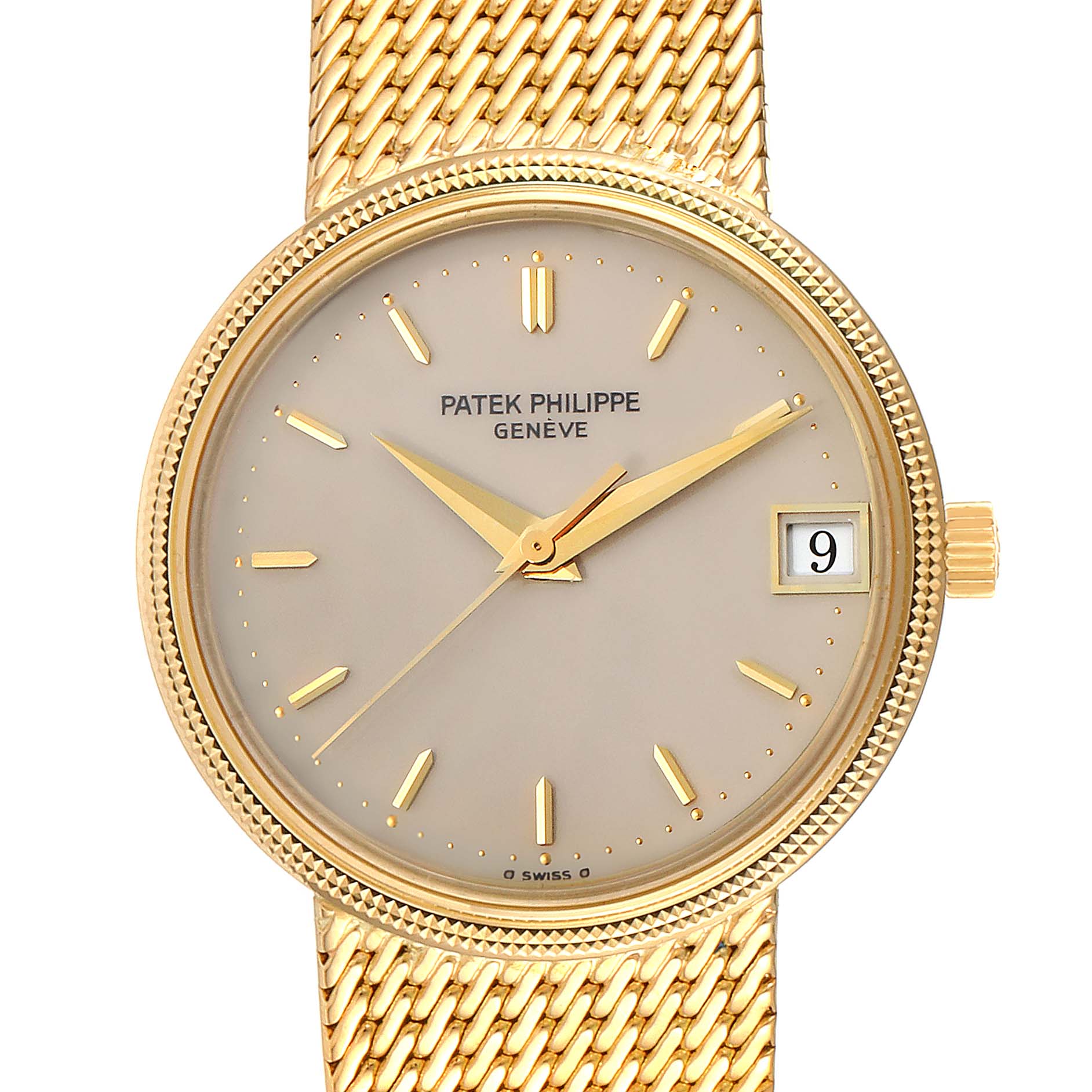This image shows the front view of a Calatrava model by Patek Philippe, featuring its dial, hands, and date display with a gold mesh band.