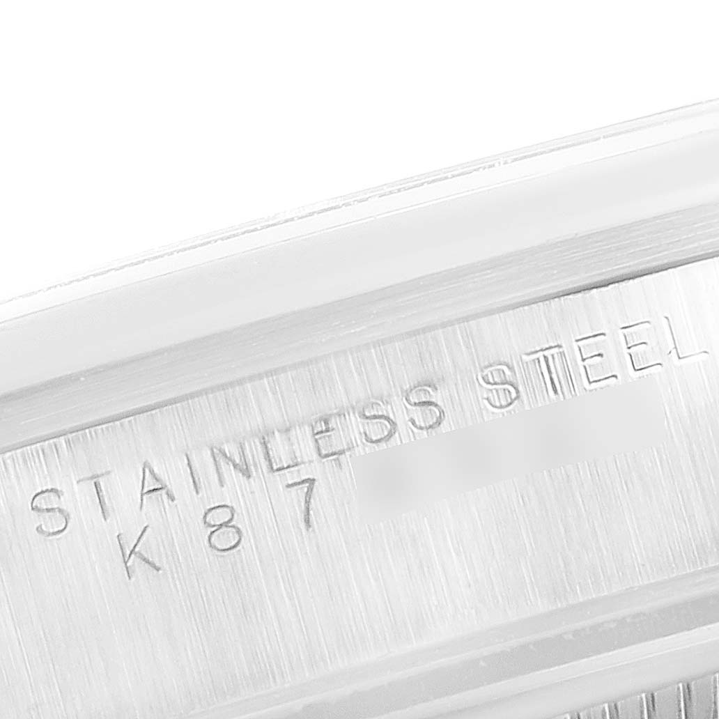 This is a close-up image showing the "Stainless Steel" engraving on the side of a Rolex Air-King 14000 Men's Stainless Steel Black Dial 14000 Men's Stainless Steel Black Dial watch.