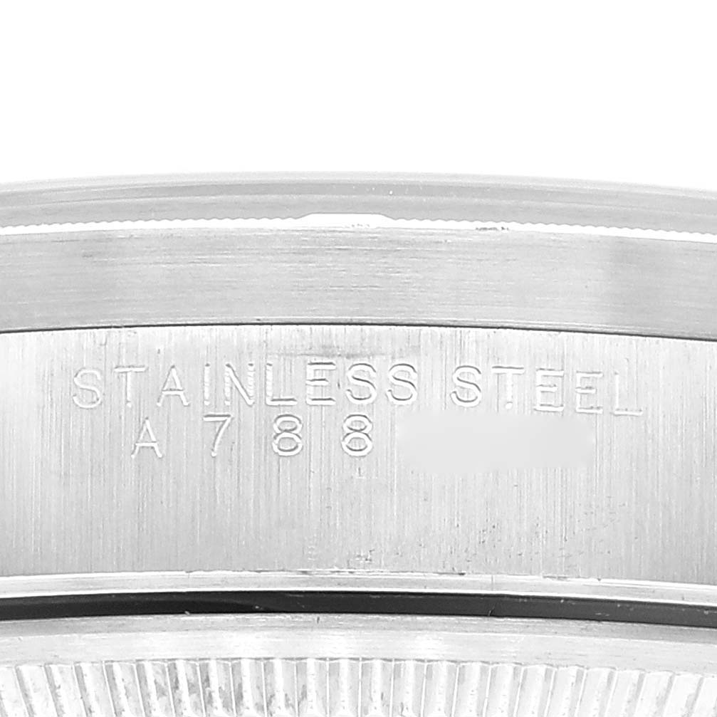 This image shows a close-up of the case back and edge of the case for the Rolex Air-King 14010 Men's Stainless Steel Pink Dial 14010 Men's Stainless Steel Pink Dial, highlighting the "Stainless Steel" engraving.