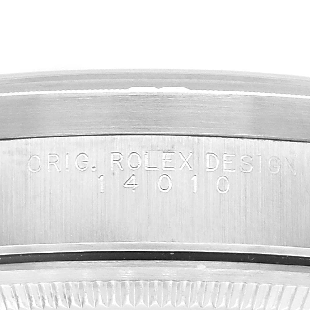 Close-up view of the casing showing the engravings and design details of a Rolex Air-King 14010 Men's Stainless Steel Pink Dial 14010 Men's Stainless Steel Pink Dial watch model 14010.