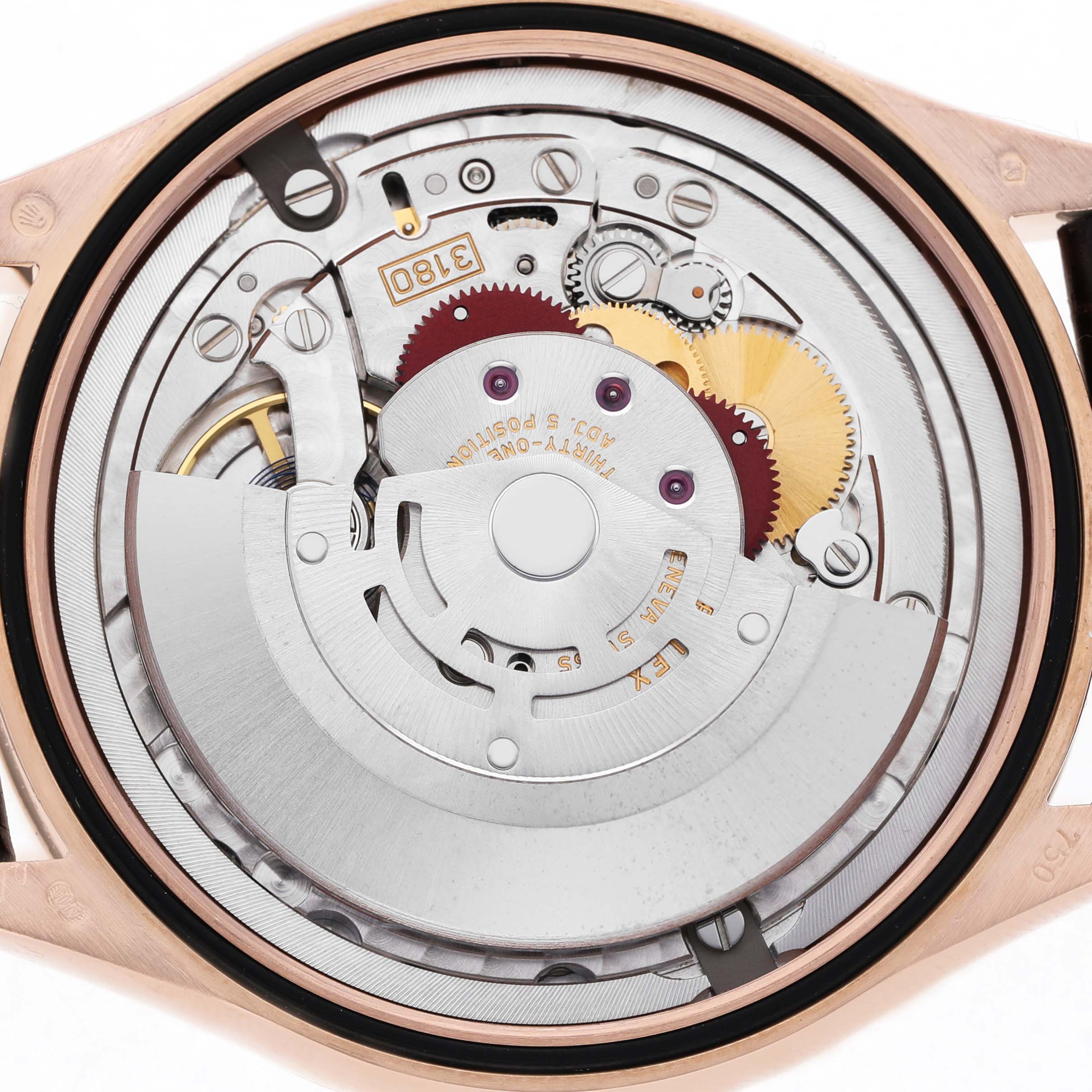The image shows the back view of a Rolex Cellini 50525 Men's Rose Gold Silver Dial watch, highlighting its intricate mechanical movement components.
