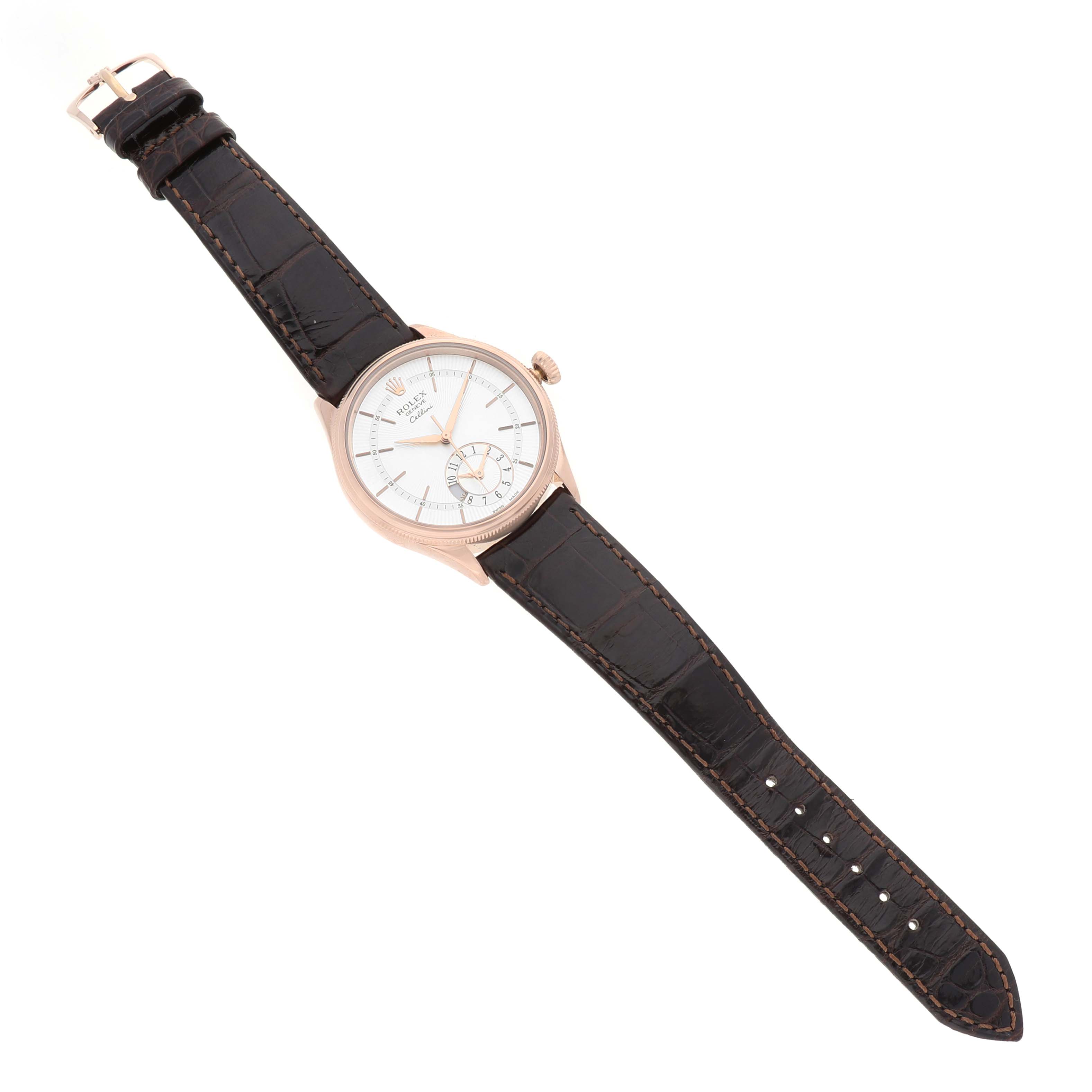 The Rolex Cellini 50525 Men's Rose Gold Silver Dial watch is shown from a top-down angle, featuring its entire face, case, and leather strap.