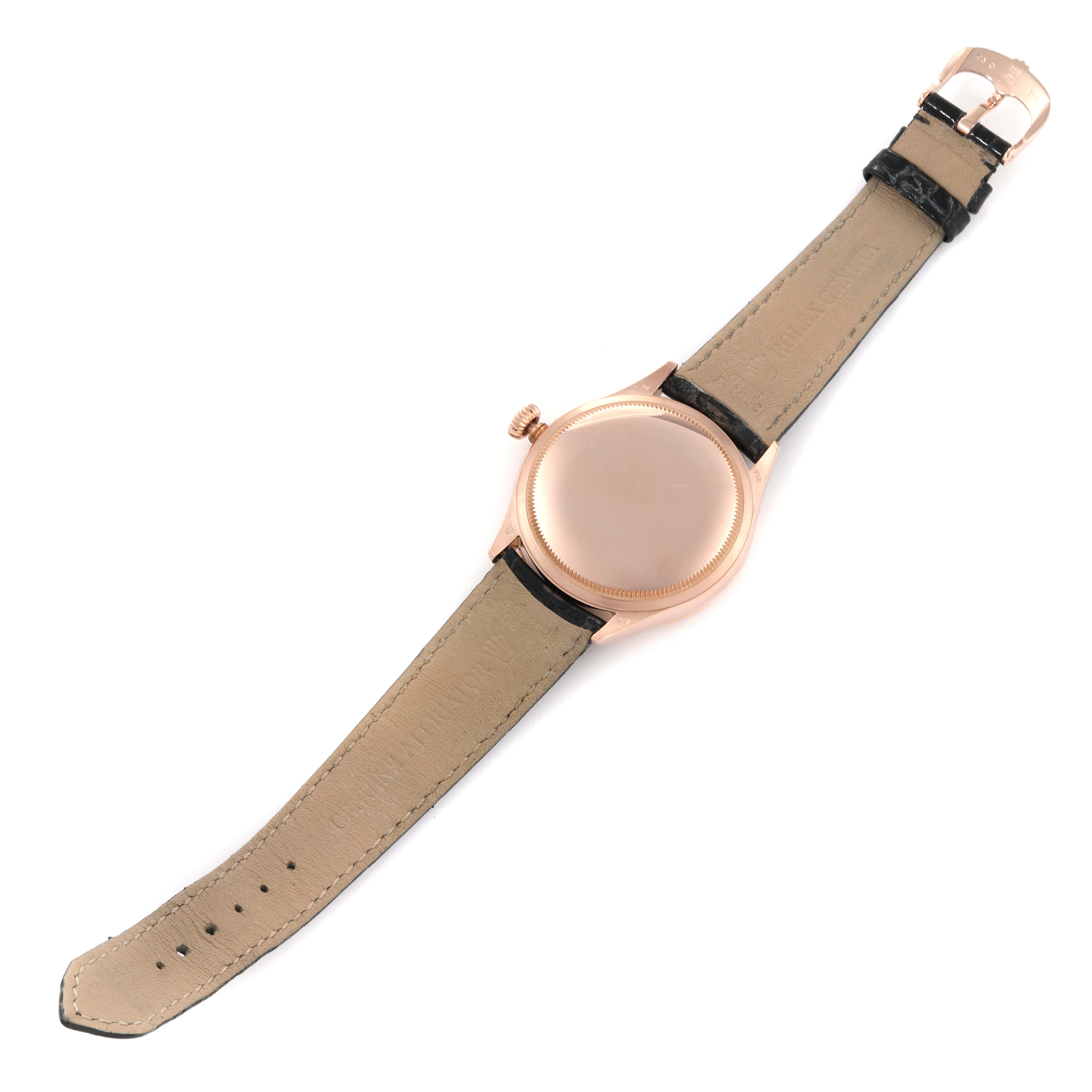 The image shows the back view of a Rolex Cellini 50505 Men's Rose Gold Black Dial 50505 Men's Rose Gold Black Dial watch with its leather strap fully extended.