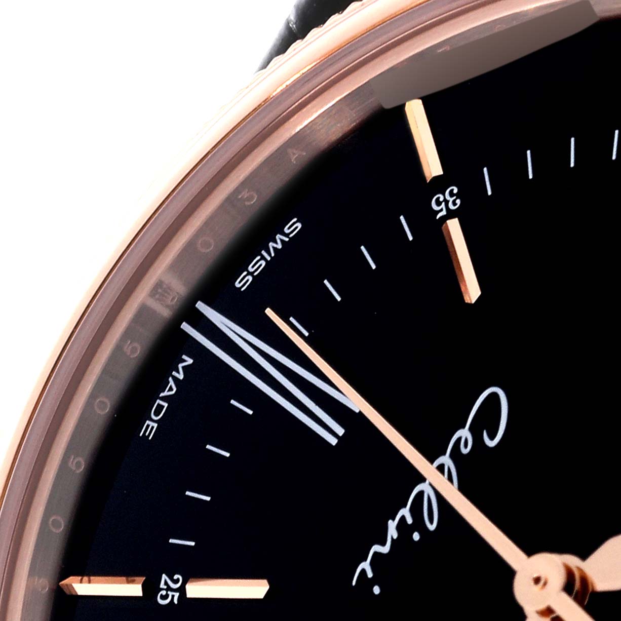 This close-up image of the Rolex Cellini 50505 Men's Rose Gold Black Dial 50505 Men's Rose Gold Black Dial watch shows part of the dial, minute and hour markers, and the "Cellini" script.
