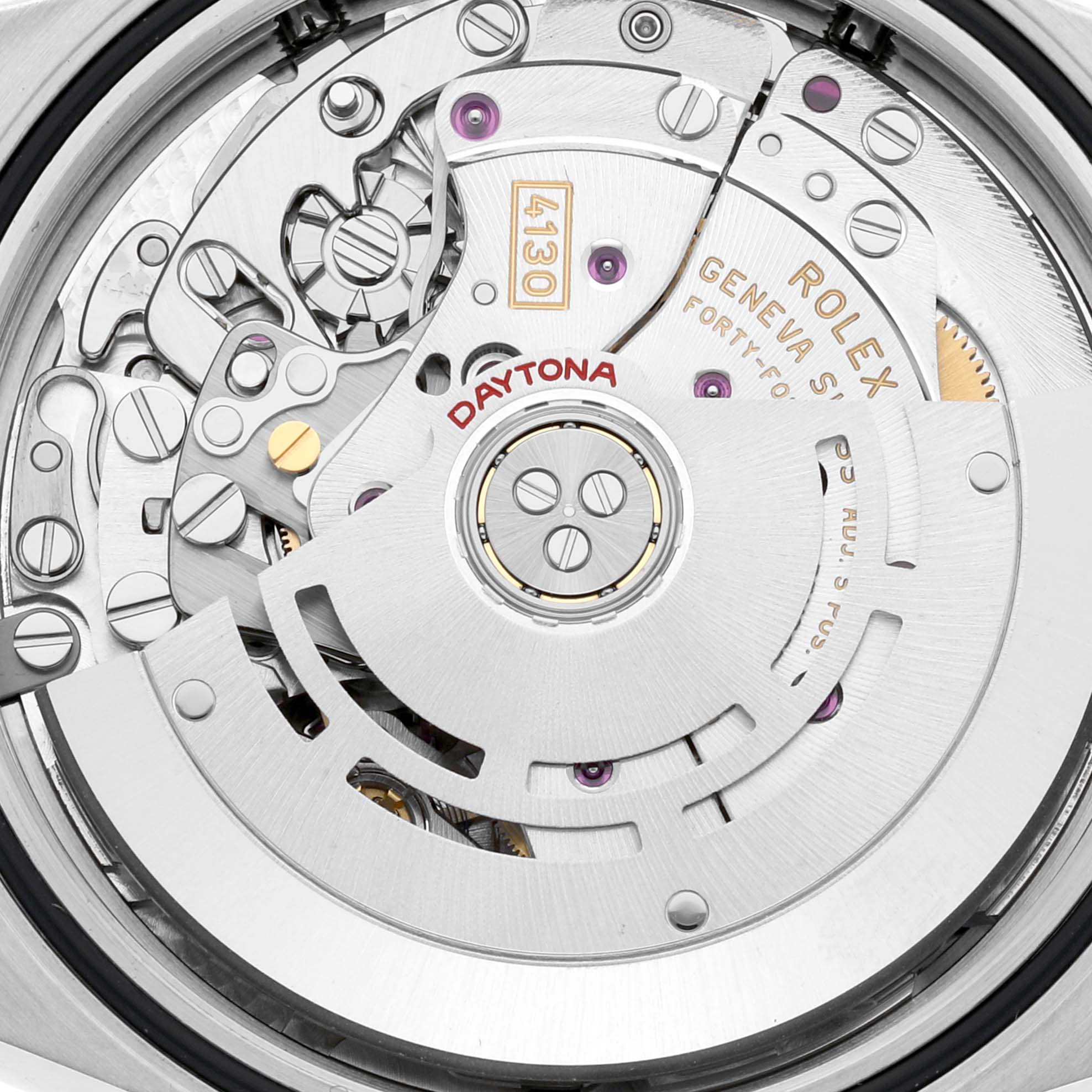 This is a detailed view of the movement mechanism of a Rolex Daytona 116500LN Men's Stainless Steel Black Dial 116500LN Men's Stainless Steel Black Dial watch, showing gears, screws, and the rotor.