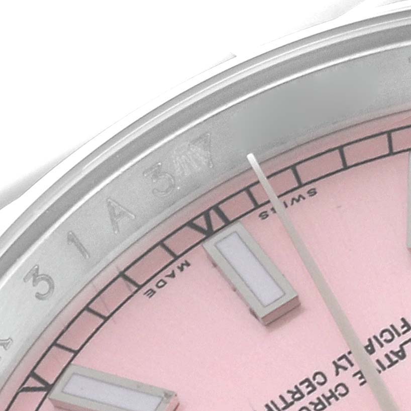 The image shows a close-up of the dial and bezel of a Rolex Datejust 116200 Men's Stainless Steel Pink Dial 116200 Men's Stainless Steel Pink Dial watch with a pink dial.