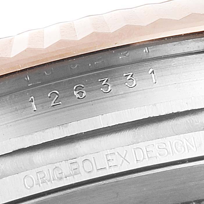 This close-up angle shows the fluted bezel and case reference number of a Rolex Datejust 41 126331 Men's Steel and Gold (two tone) Brown Dial 126331 Men's Steel and Gold (two tone) Brown Dial.