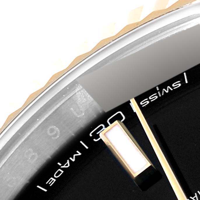 This image shows a close-up of the dial, bezel edge, and minute hand of the Rolex Datejust 41 126333 Men's Steel and Gold (two tone) Black Dial 126333 Men's Steel and Gold (two tone) Black Dial.