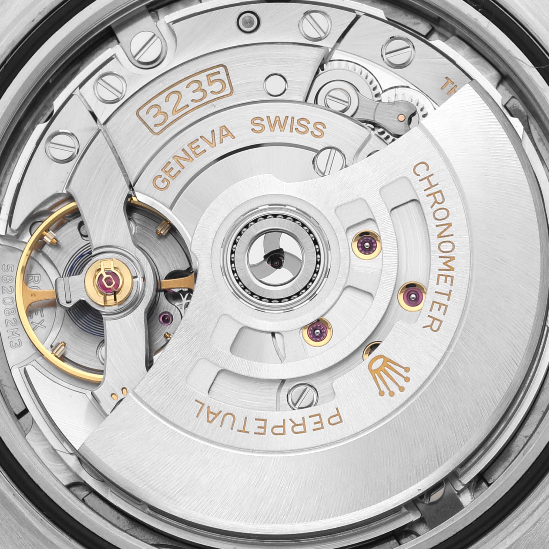 The image shows a close-up of the movement mechanism inside a Rolex Datejust 41 126333 Men's Steel and Gold (two tone) Grey Dial 126333 Men's Steel and Gold (two tone) Grey Dial, displaying the intricate details of the calibre 3235.