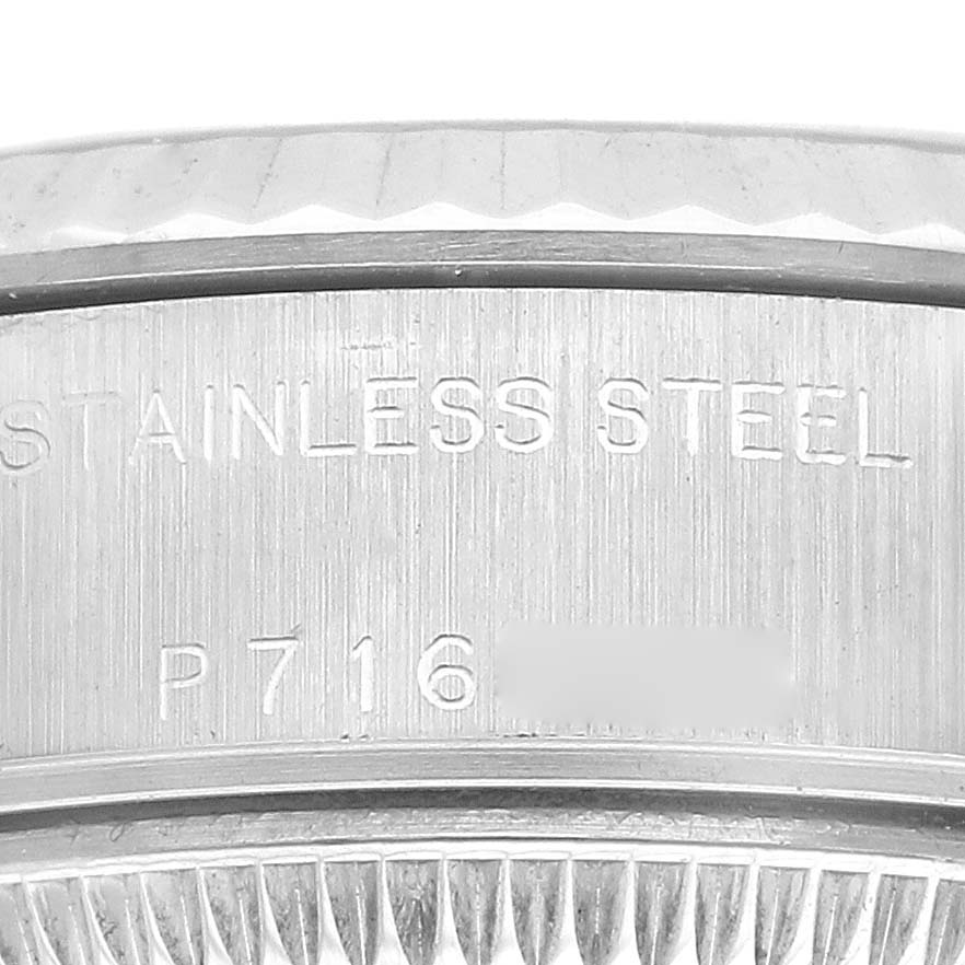 This image shows a close-up of the stainless steel bezel area of a Rolex Datejust 79174 Women's Stainless Steel Blue Dial 79174 Women's Stainless Steel Blue Dial watch.