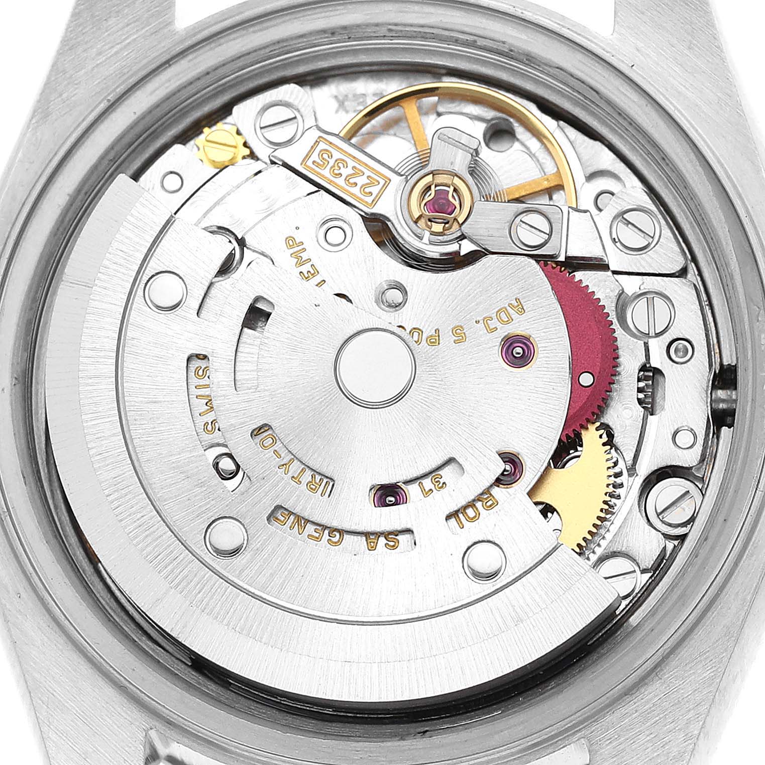 This image shows the inner mechanism of a Rolex Datejust 79174 Women's Stainless Steel Blue Dial 79174 Women's Stainless Steel Blue Dial watch, focusing on the movement parts and gears.