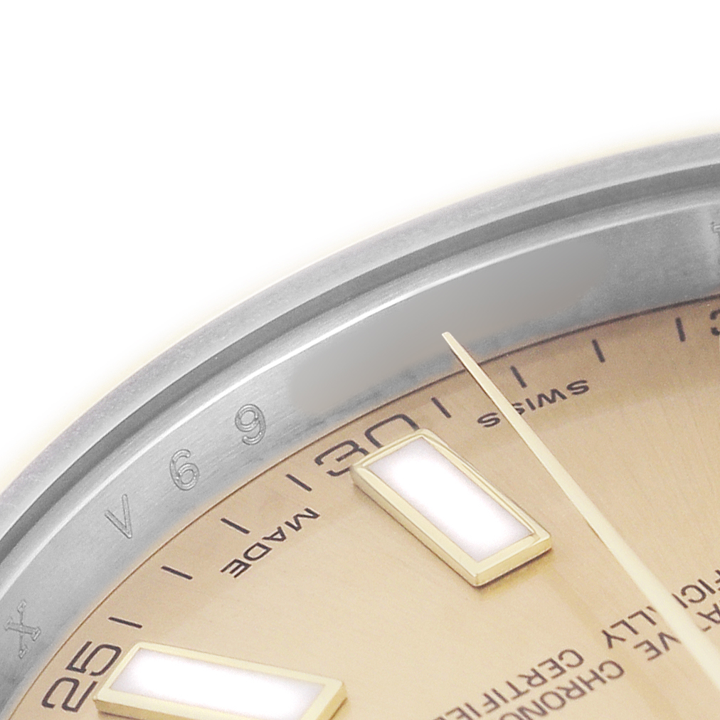 The image shows a close-up of the dial and bezel of a Rolex Datejust 41 116333 Men's Stainless Steel Champagne Dial, highlighting the hour markers and minute track.