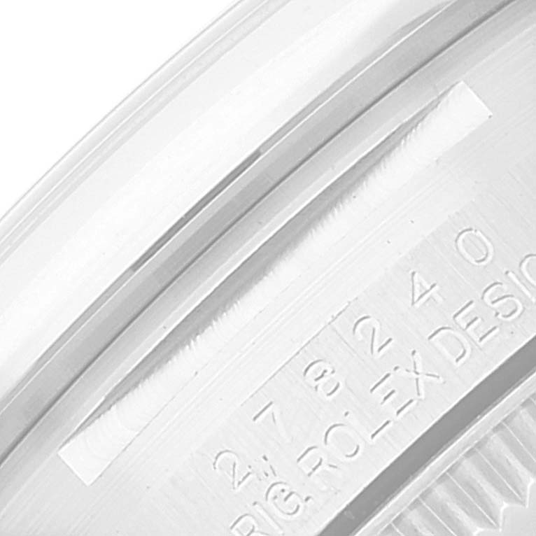 This close-up image shows the side view of the bezel and the engraved serial number on a Rolex Mid-Size 278240 Women's Stainless Steel Grey Dial 278240 Women's Stainless Steel Grey Dial model.
