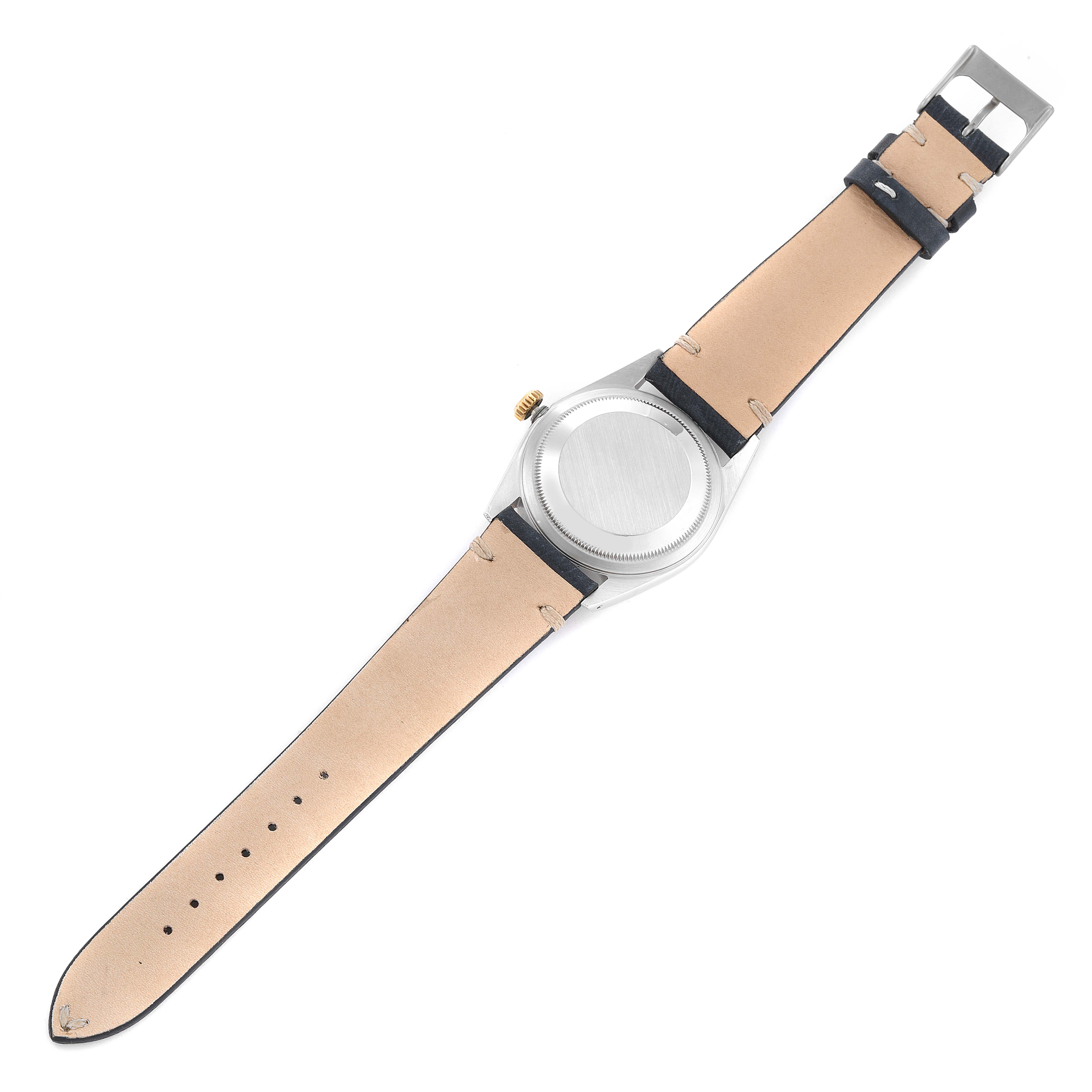 The image shows the back view of a Rolex Datejust 16233 Men's Steel and Gold (two tone) Champagne Dial 16233 Men's Steel and Gold (two tone) Champagne Dial watch with a leather strap fully extended.