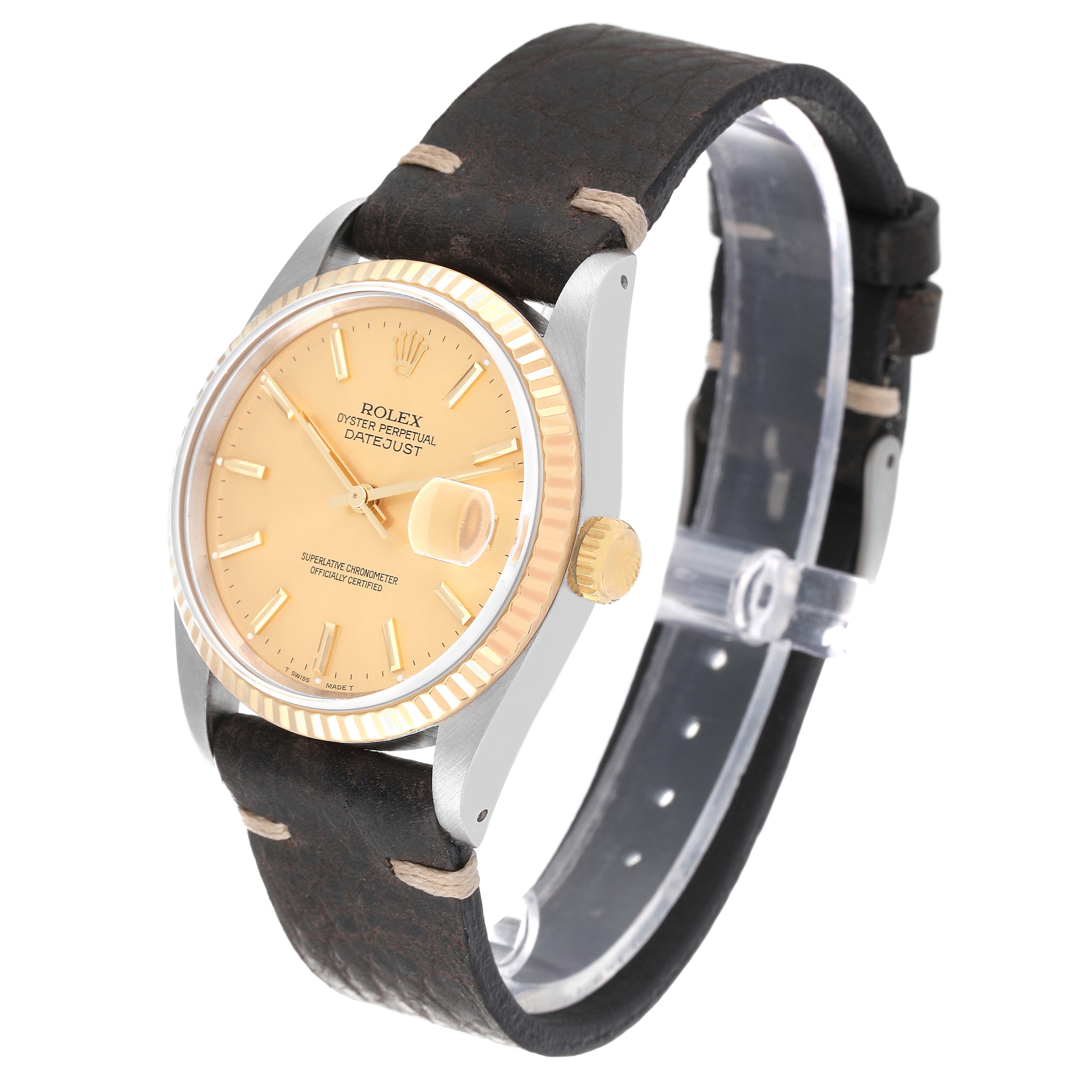 This image shows a Rolex Datejust 16233 Men's Steel and Gold (two tone) Champagne Dial 16233 Men's Steel and Gold (two tone) Champagne Dial watch at an angle, featuring a leather strap, fluted bezel, date magnifier, and crown.