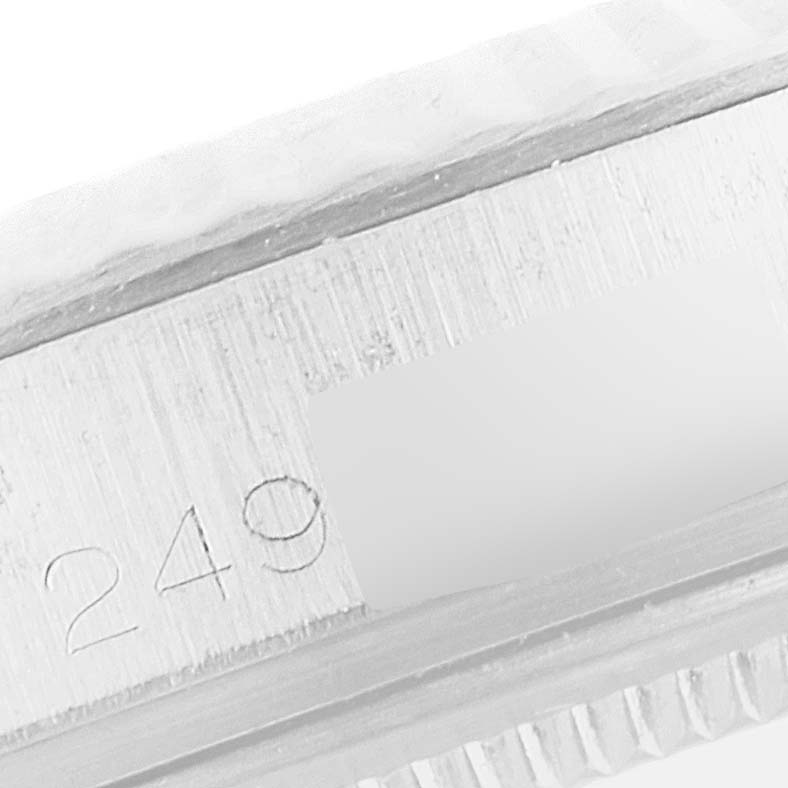 This close-up image shows the serial number engraving on the side of a Rolex Vintage Collection 1601 Men's Stainless Steel Silver Dial 1601 Men's Stainless Steel Silver Dial model.