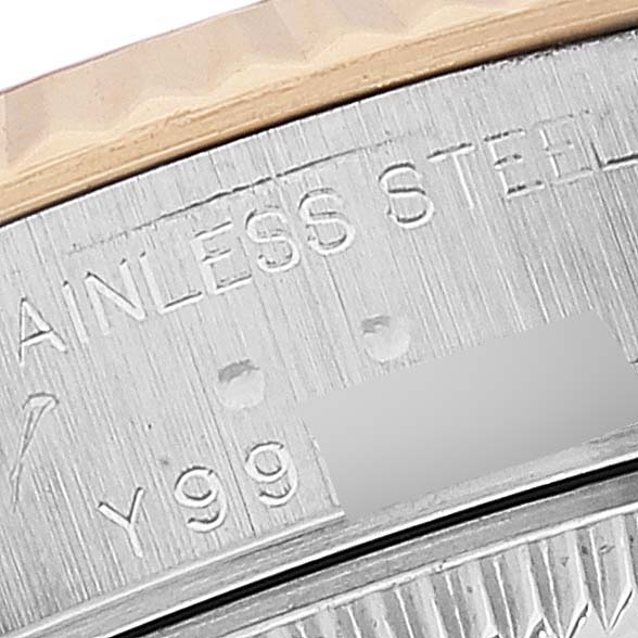 This image shows a close-up of the side of the Rolex Datejust 79173 Women's Steel and Gold (two tone) Champagne Dial 79173 Women's Steel and Gold (two tone) Champagne Dial watch's case, featuring its stainless steel marking.
