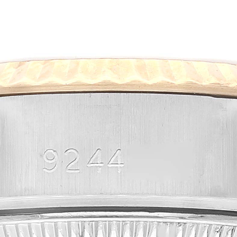 This close-up image shows the serial number and part of the bezel on a Rolex Datejust 69173 Women's Steel and Gold (two tone) Champagne Dial 69173 Women's Steel and Gold (two tone) Champagne Dial watch.