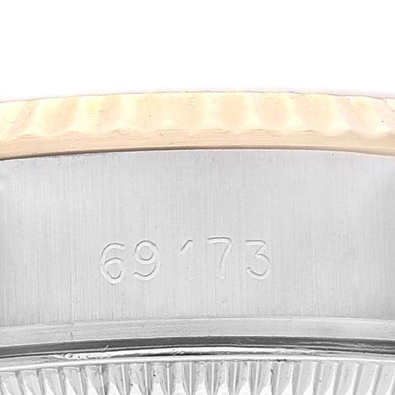 The image shows a close-up of the side of a Rolex Datejust 69173 Women's Steel and Gold (two tone) Champagne Dial 69173 Women's Steel and Gold (two tone) Champagne Dial model watch case with the model number 69173 engraved.