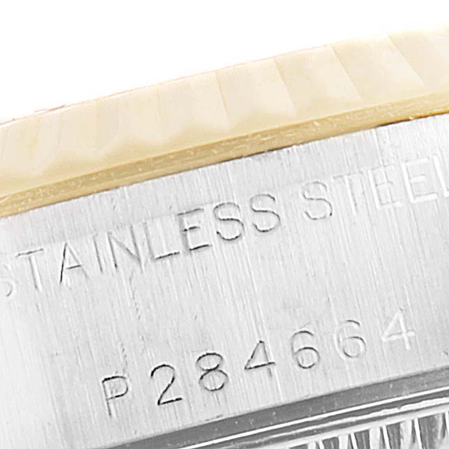 The image shows a close-up of the Rolex Datejust 79173 Women's Steel and Gold (two tone) Black Dial 79173 Women's Steel and Gold (two tone) Black Dial, highlighting its stainless steel case back with an engraved serial number.