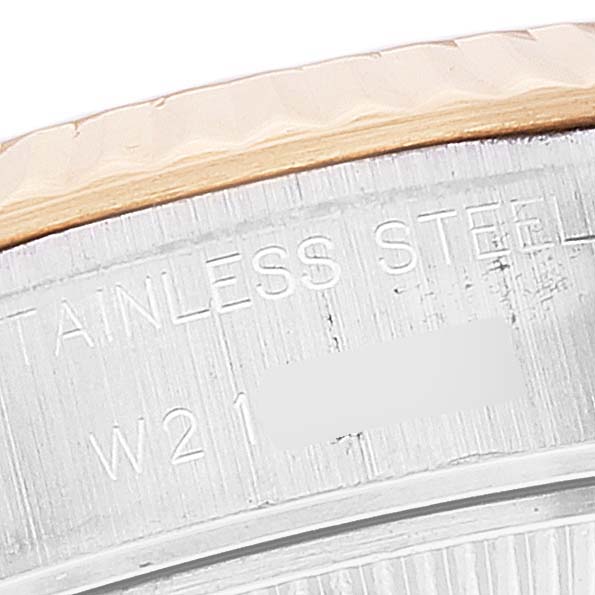 This close-up image of the Rolex Datejust 69173 Women's Steel and Gold (two tone) White Dial 69173 Women's Steel and Gold (two tone) White Dial watch shows part of the case back with engraved text, including "STAINLESS STEEL."