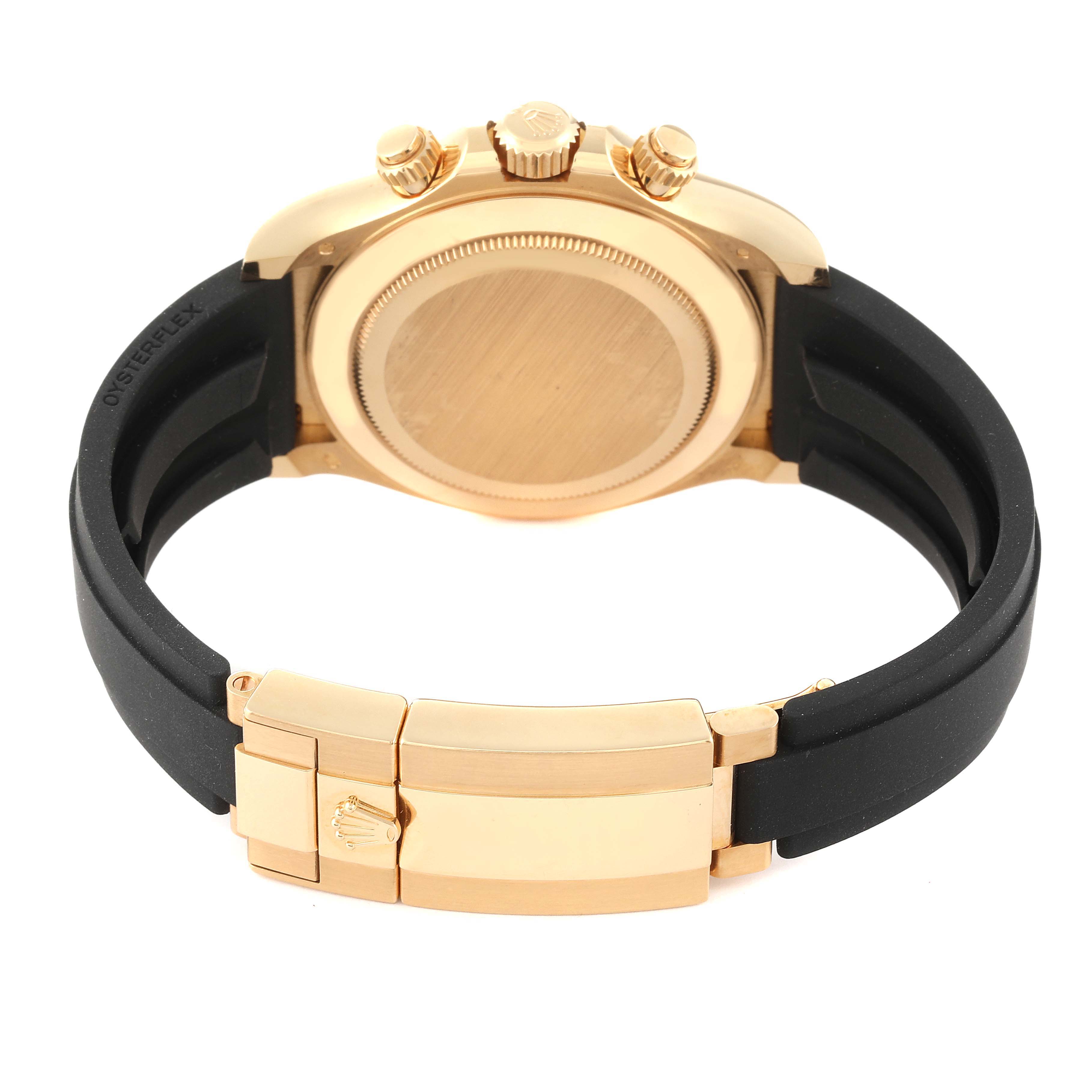 The image shows the back case, crown, pushers, and clasp of a Rolex Daytona 116518 Men's Yellow Gold White Dial 116518 Men's Yellow Gold White Dial watch.