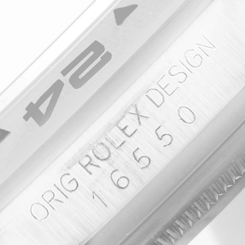 The image shows a close-up of the model number and "ORIG ROLEX DESIGN" inscription on the case of a Rolex Explorer 16550 Men's Stainless Steel White Dial 16550 Men's Stainless Steel White Dial watch.