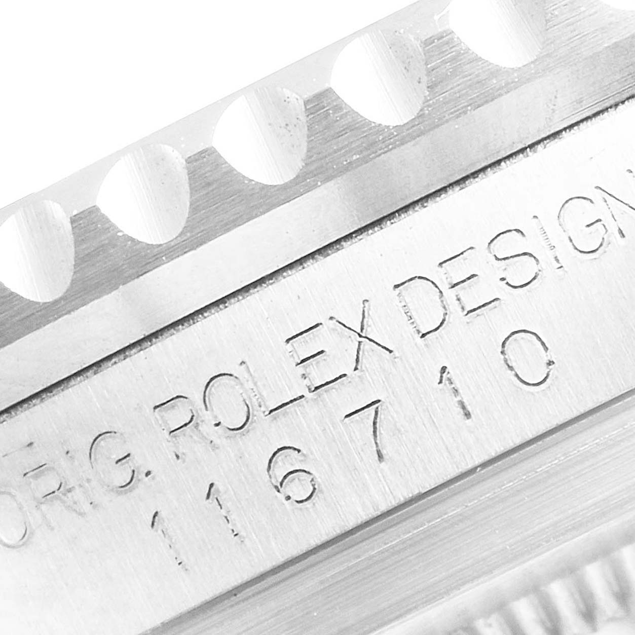 The image shows a close-up of the model number engraving and bezel edge of a Rolex GMT-Master 116710 Men
s Stainless Steel Black Dial 116710 Men
s Stainless Steel Black Dial watch.