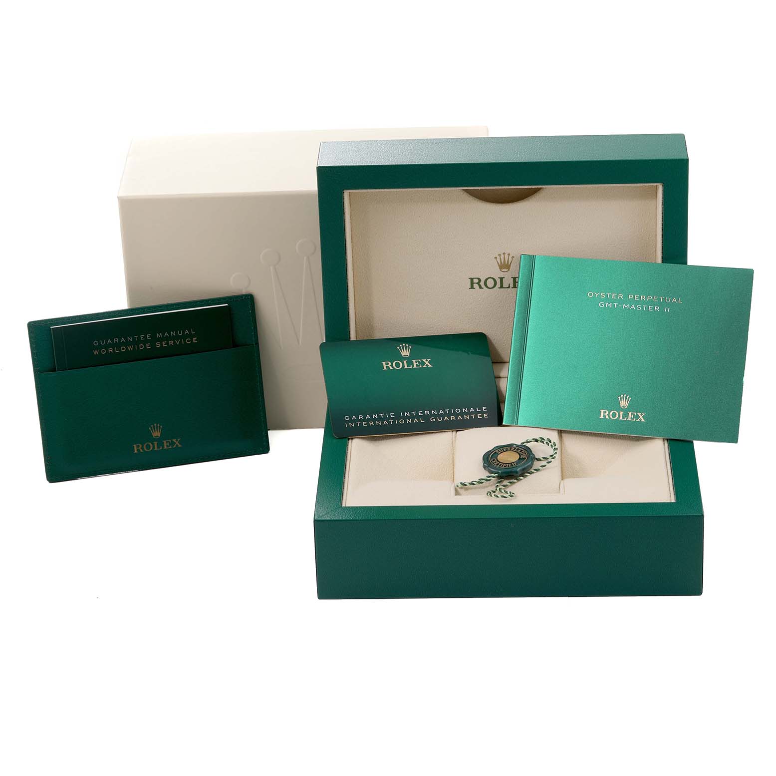 The image shows the open box of a Rolex GMT-Master 126710BLRO Men's Stainless Steel Black Dial 126710BLRO Men's Stainless Steel Black Dial watch with manuals, warranty card, and tags.