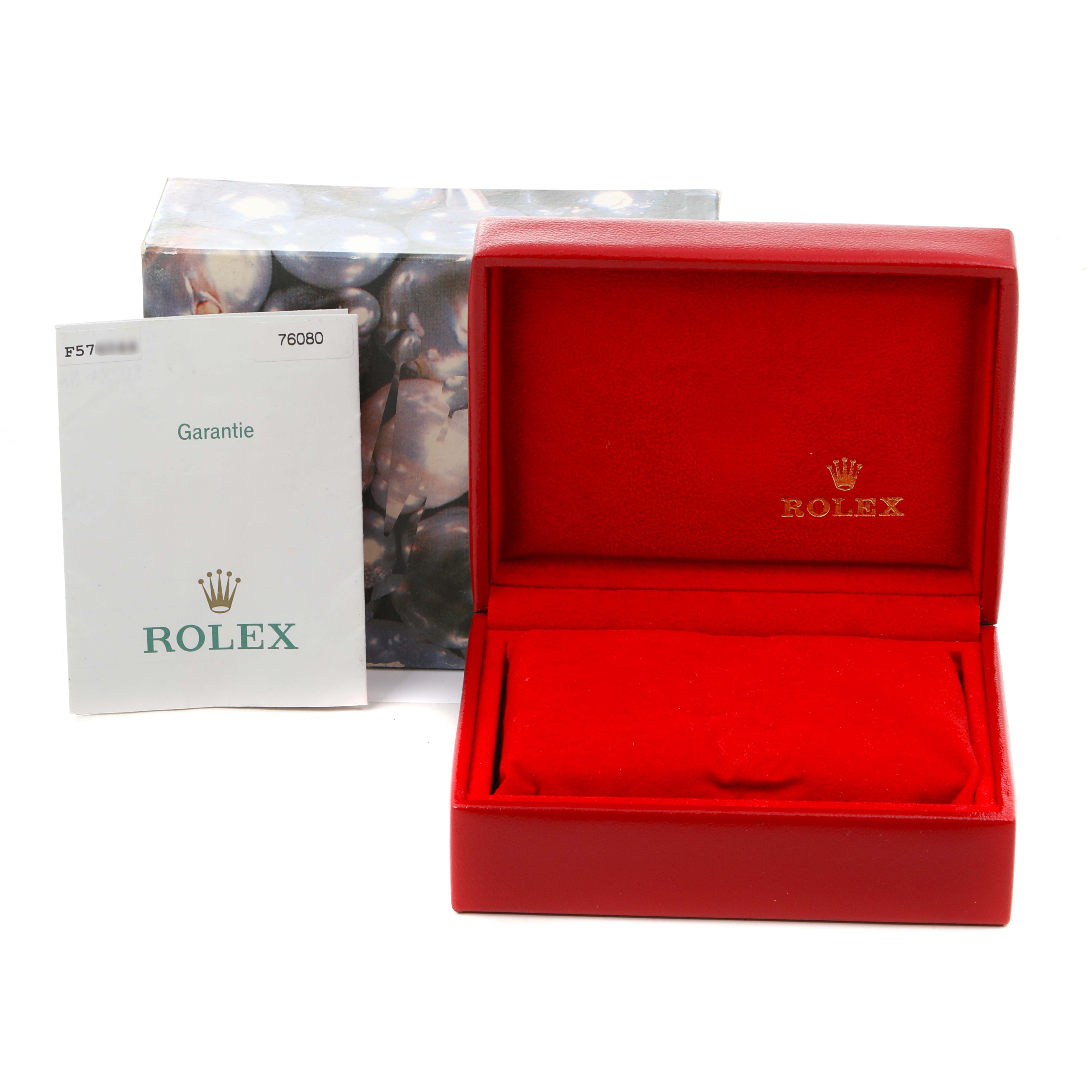 The image shows a red Rolex watch box and a warranty card for the Oyster Perpetual model.