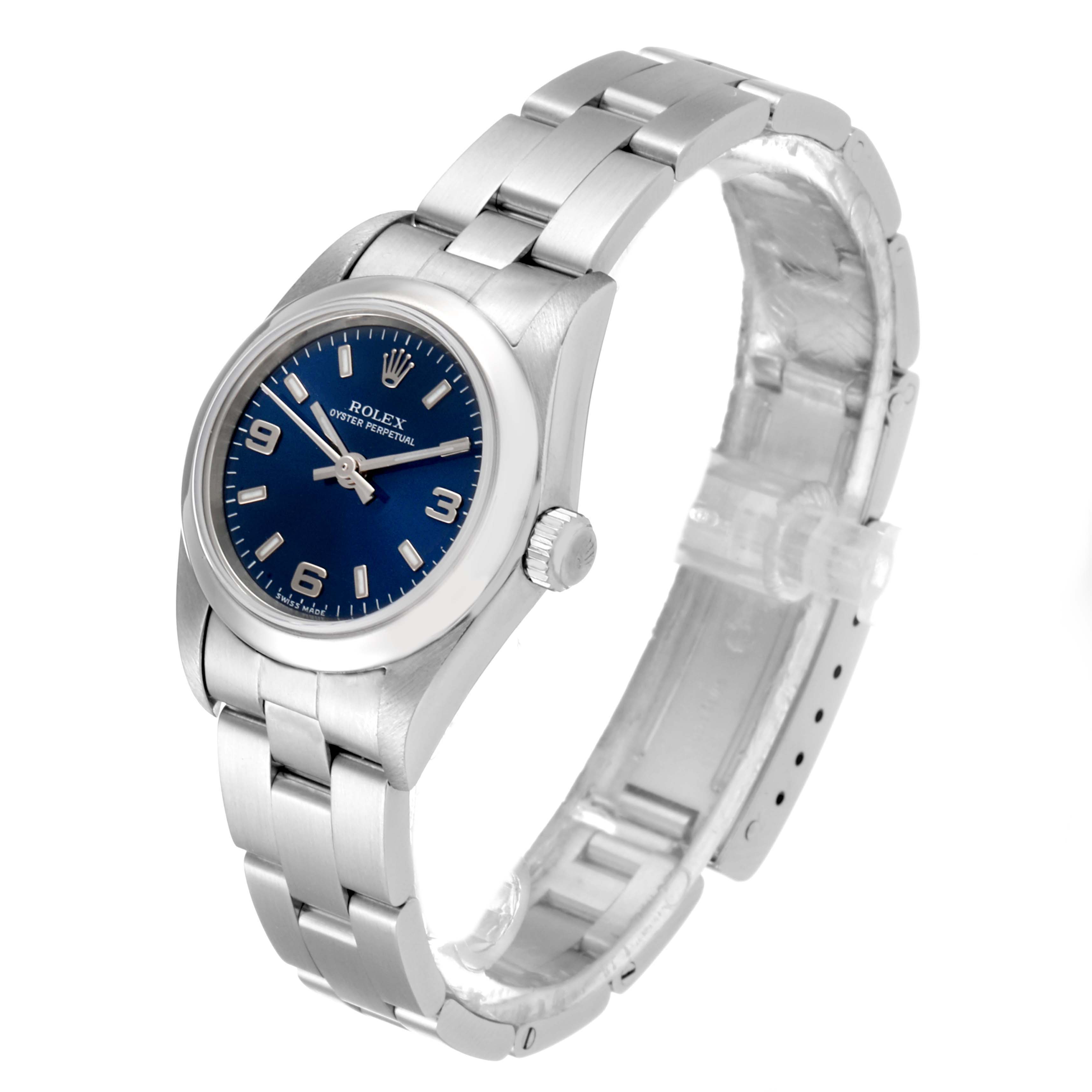 The image shows a Rolex Oyster Perpetual 76080 Women
s Stainless Steel Blue Dial 76080 Women
s Stainless Steel Blue Dial watch at an angled view, highlighting the blue dial, bracelet, and crown.