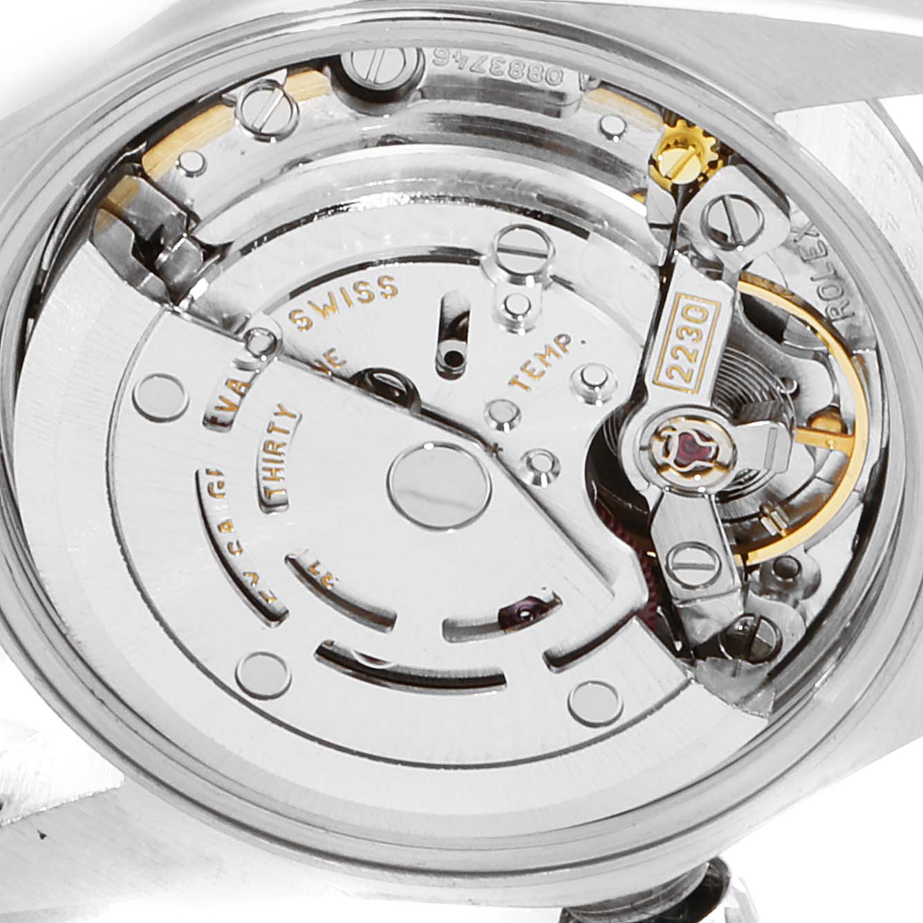 The image shows the internal mechanism and movement of the Rolex Oyster Perpetual 76080 Women
s Stainless Steel Blue Dial 76080 Women
s Stainless Steel Blue Dial watch from a close-up angle.